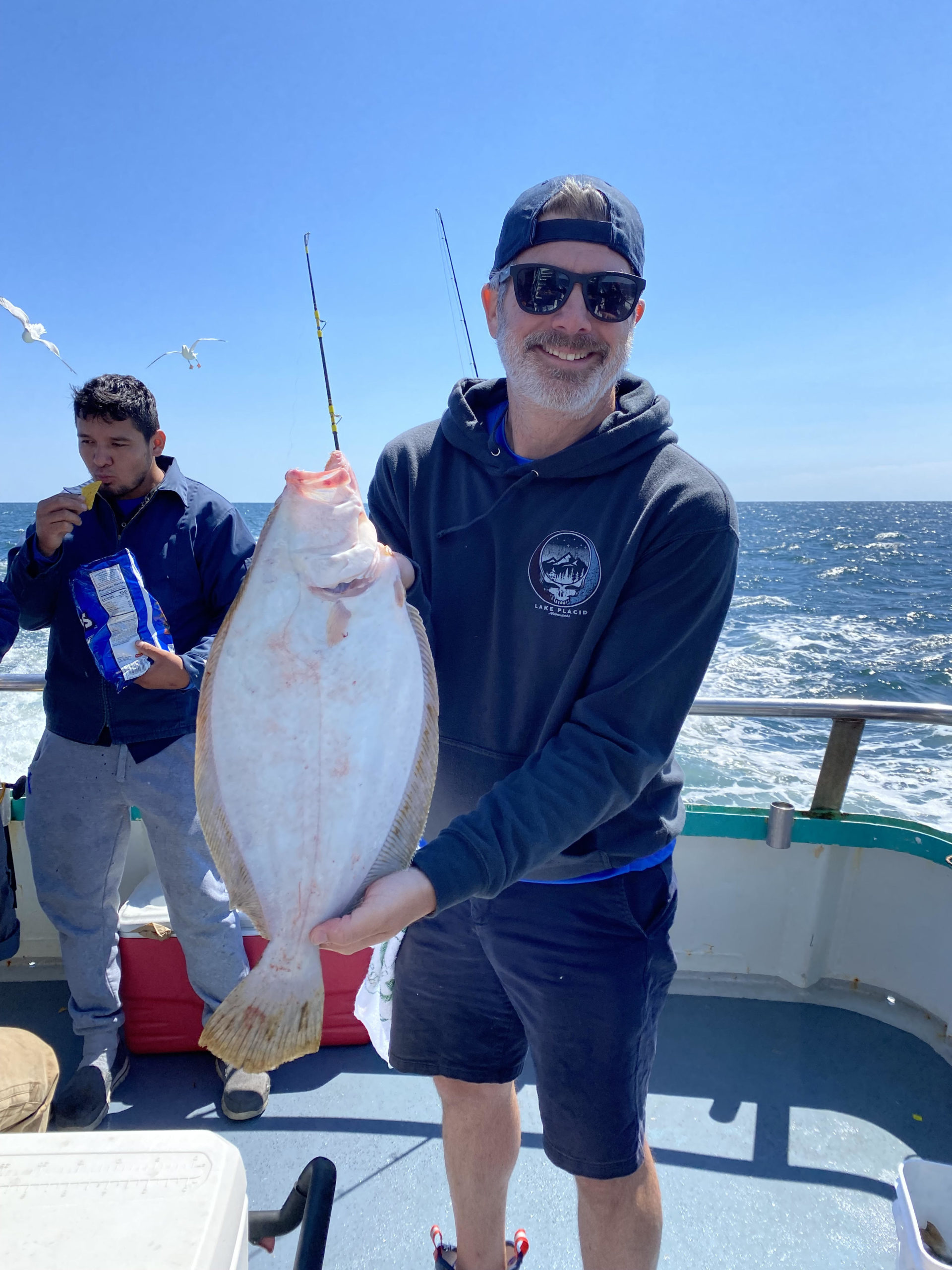 a man holding a fish