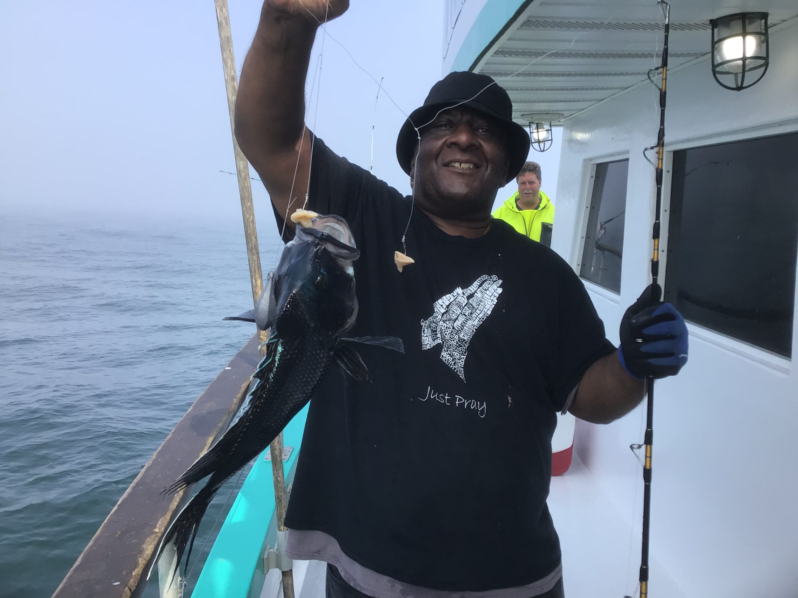 a person holding a fish in the water