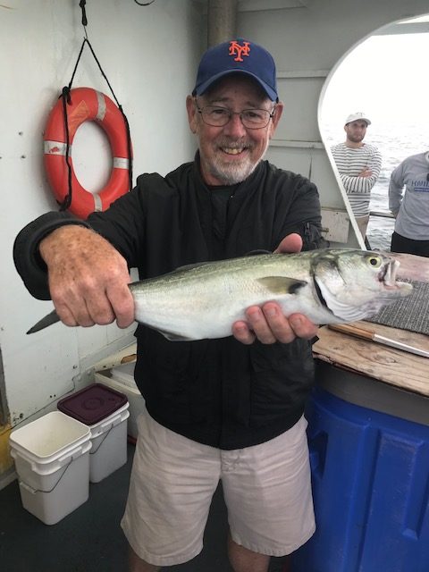a man holding a fish