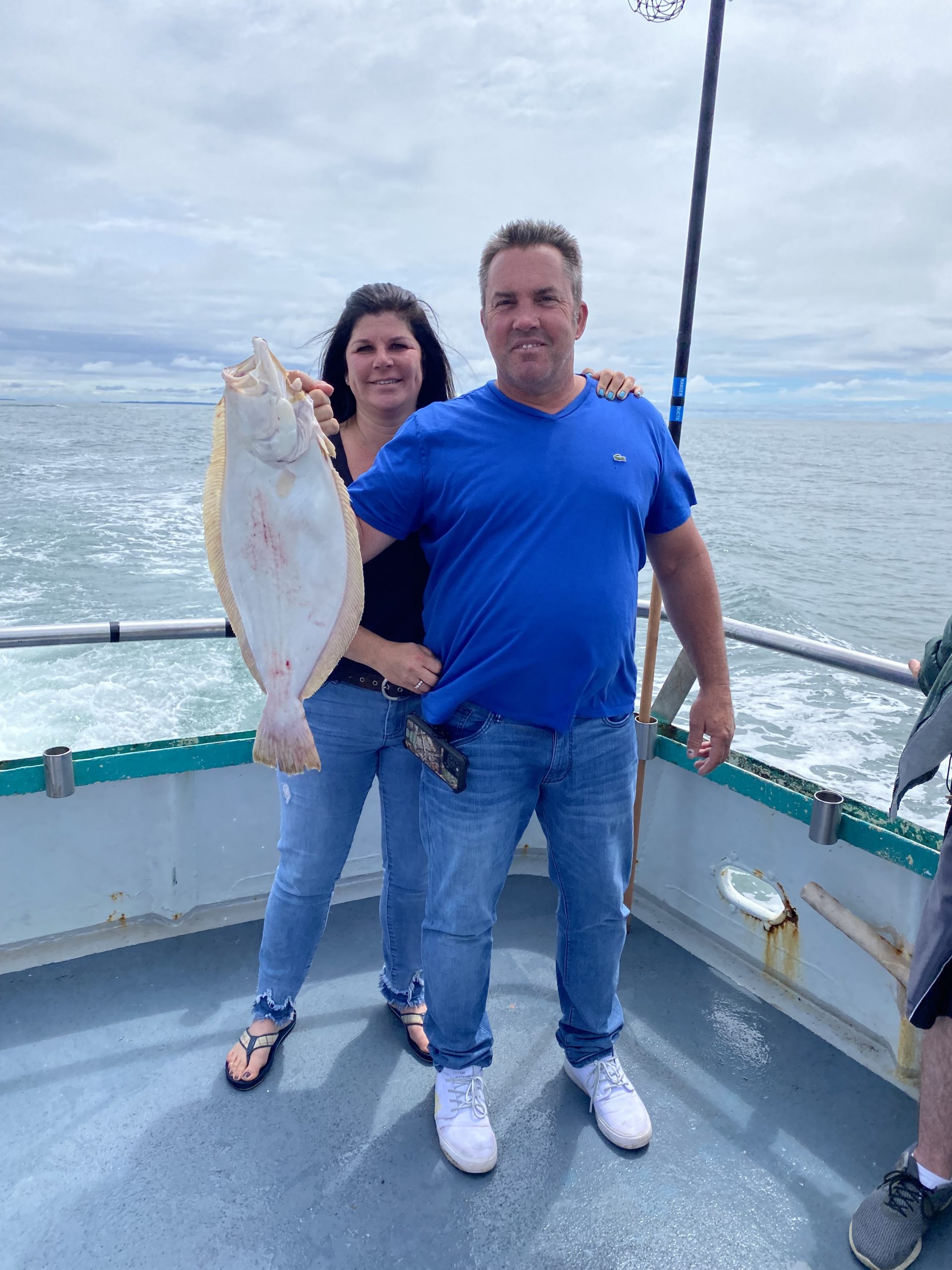 a person holding a fish in the water