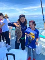 a couple of people that are standing in the snow