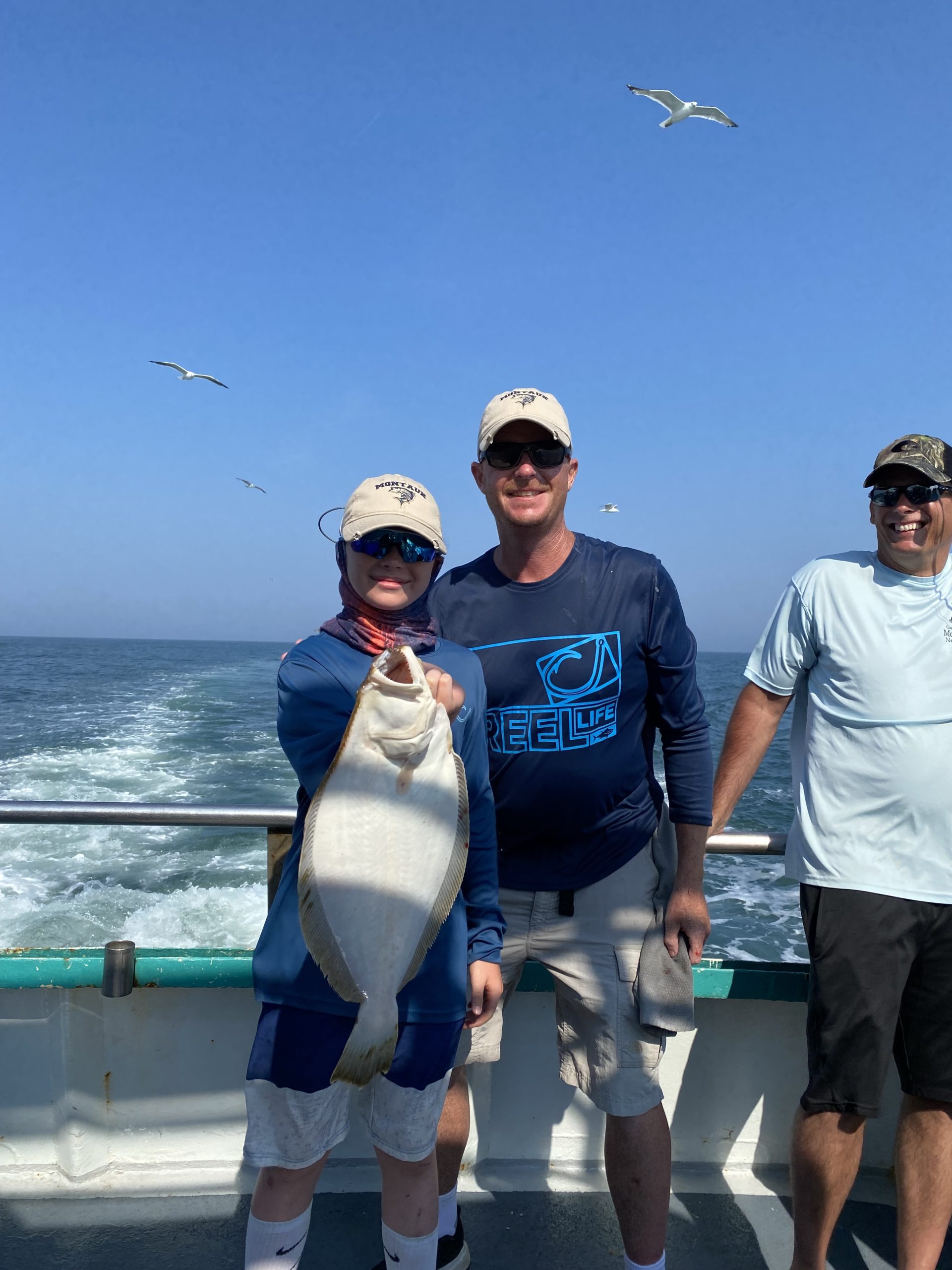 a couple of people that are standing in the water