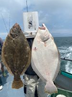 a man holding a fish