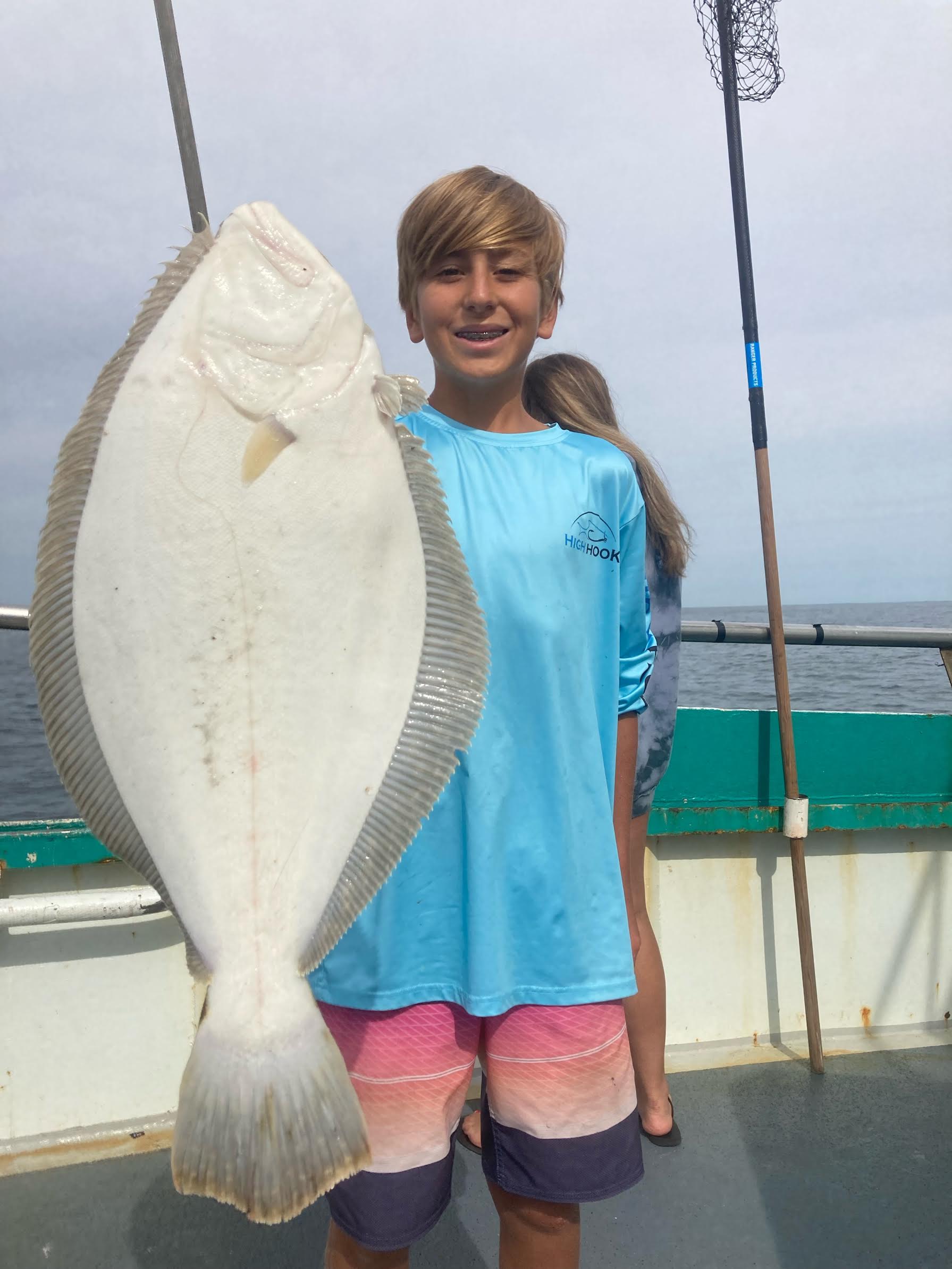 a person holding a fish