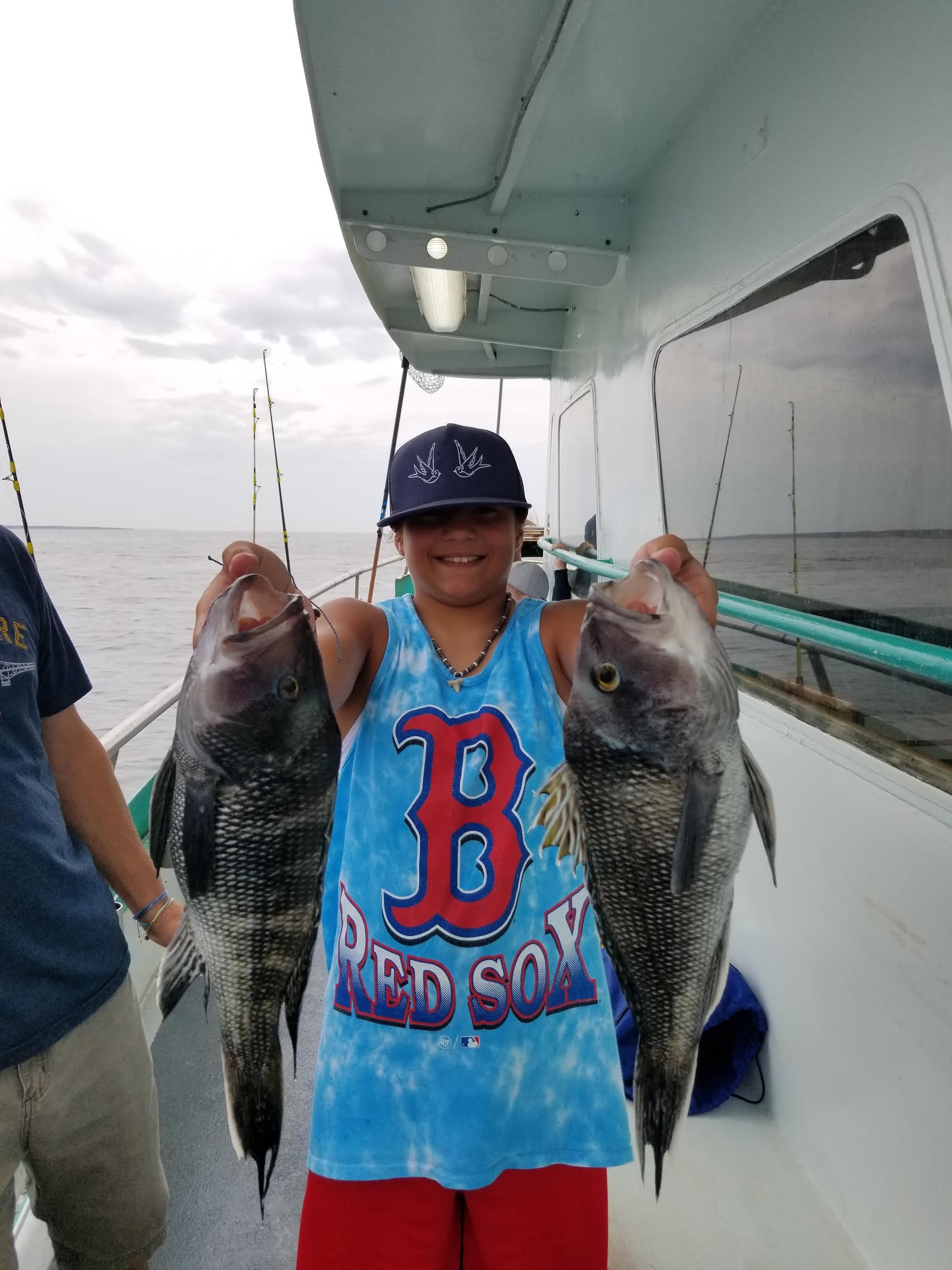 a person holding a fish