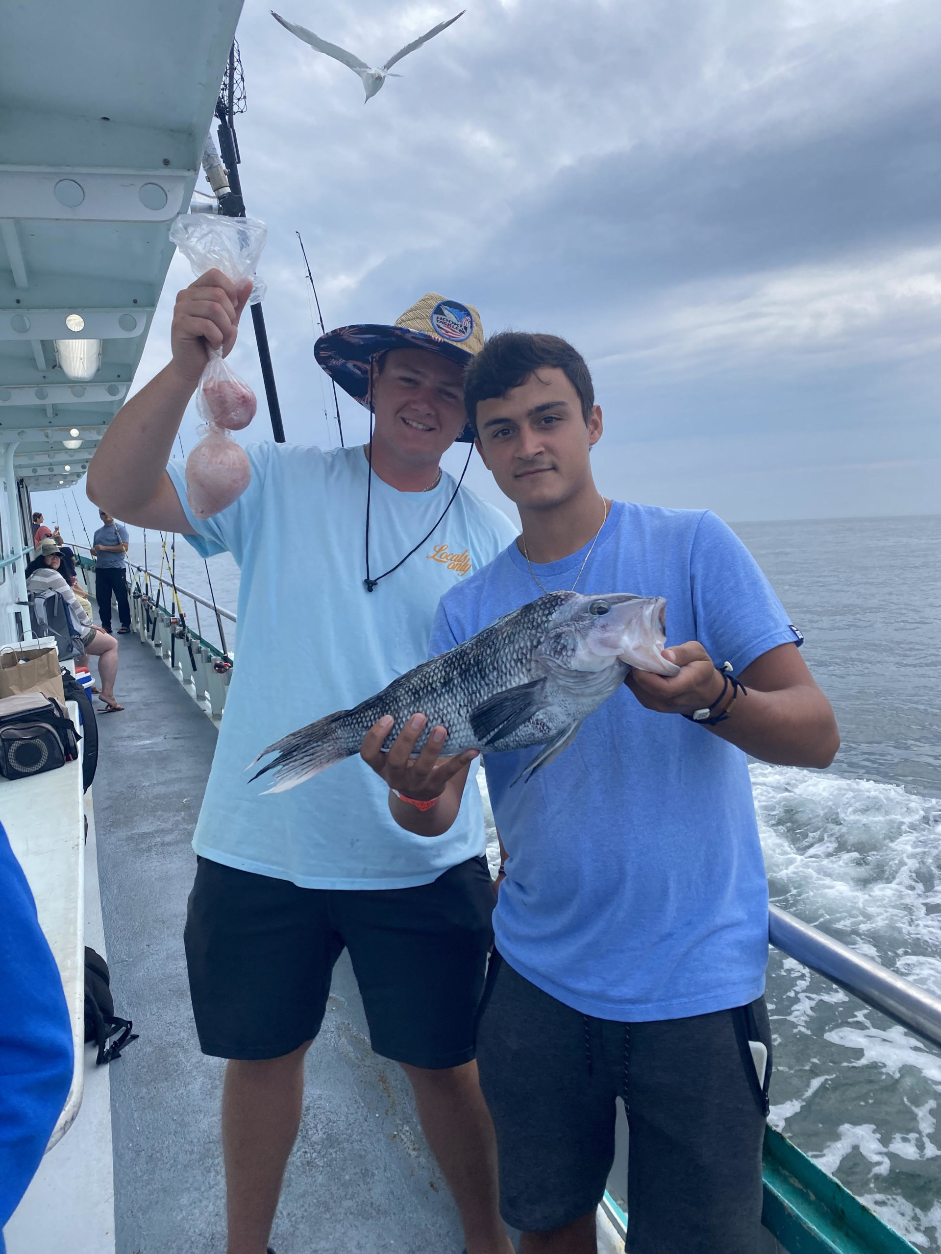 a person holding a fish in the water
