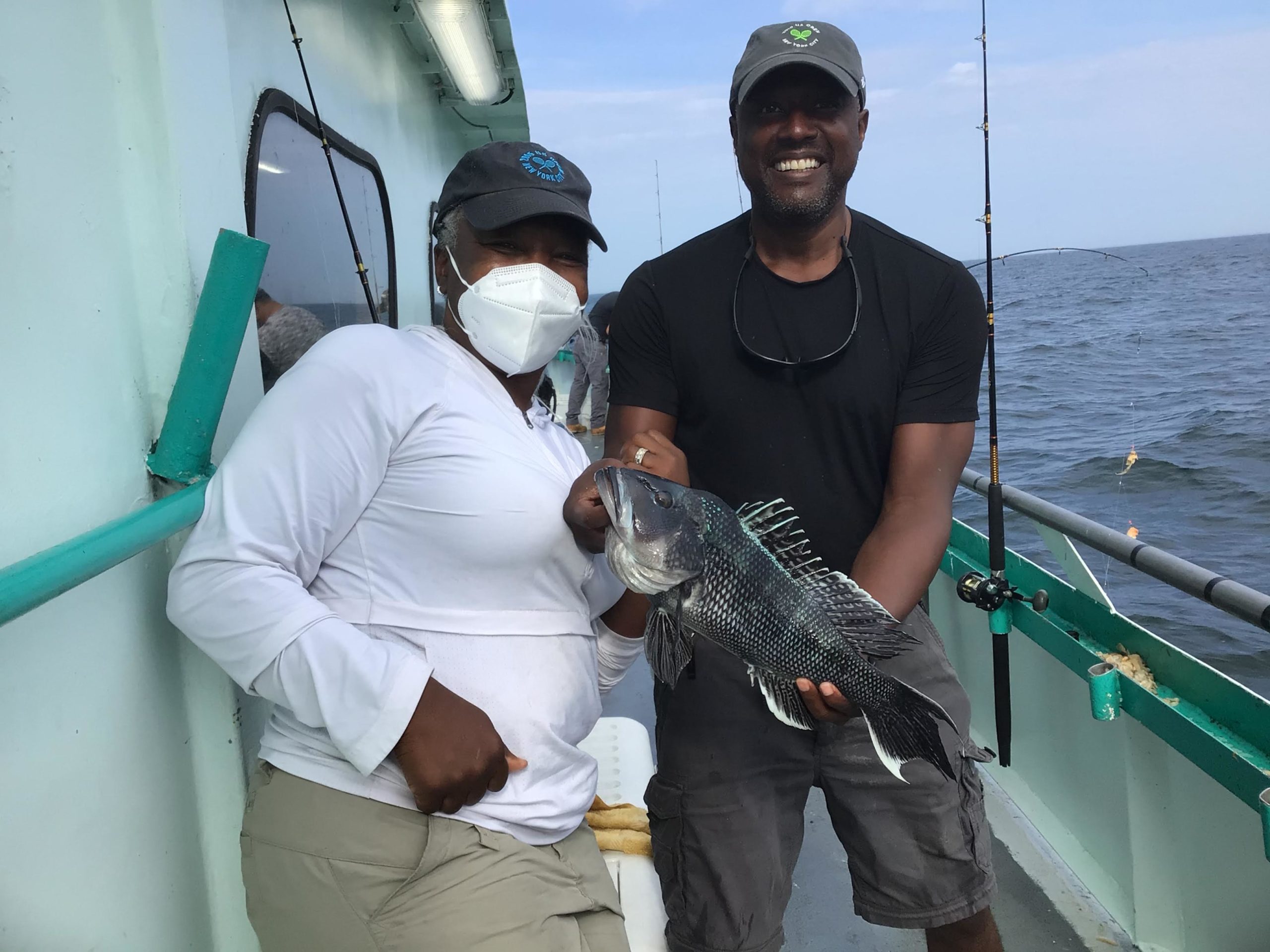a man holding a glass of water
