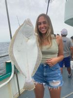 a woman holding a fish