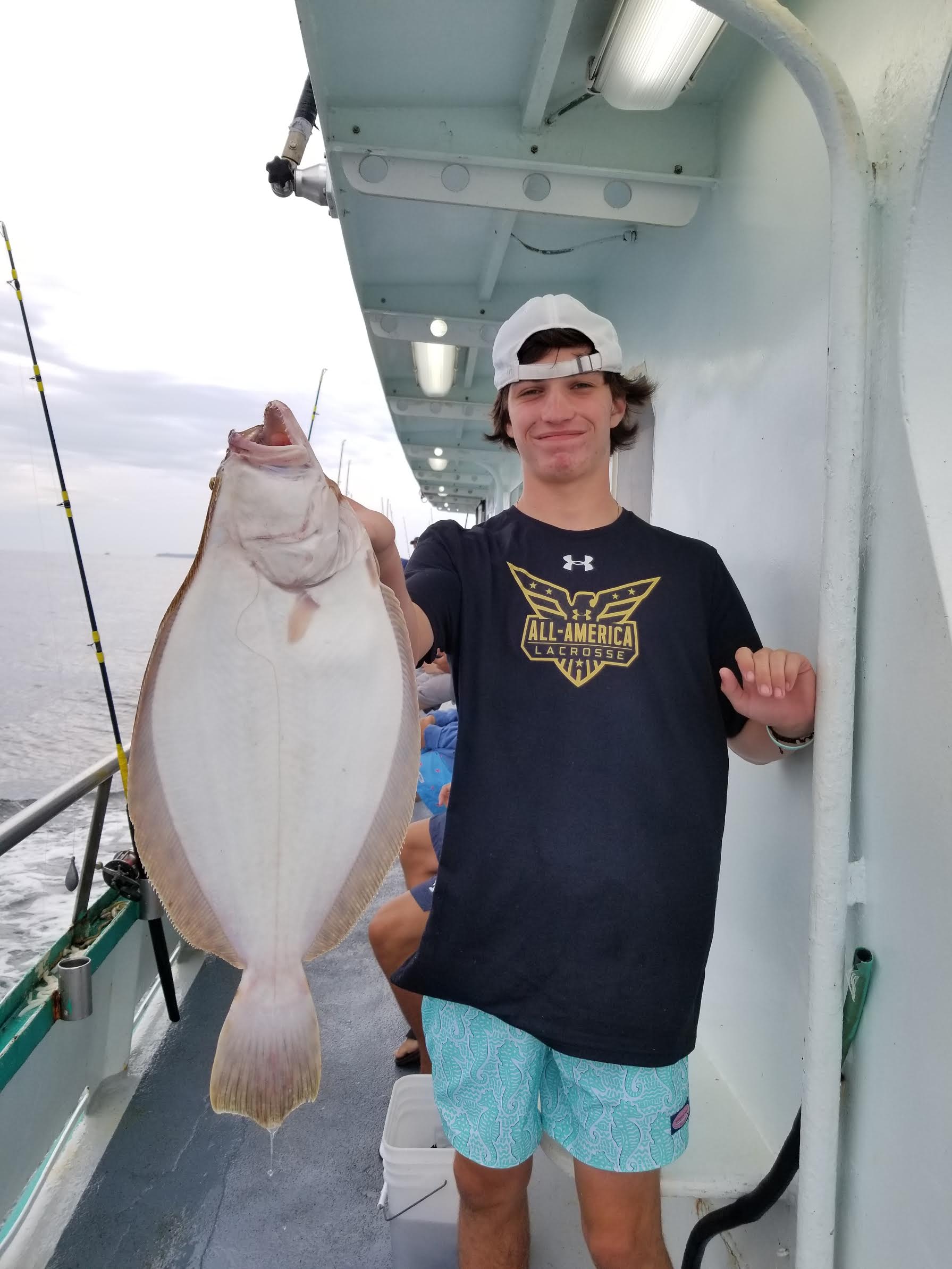 a person holding a fish