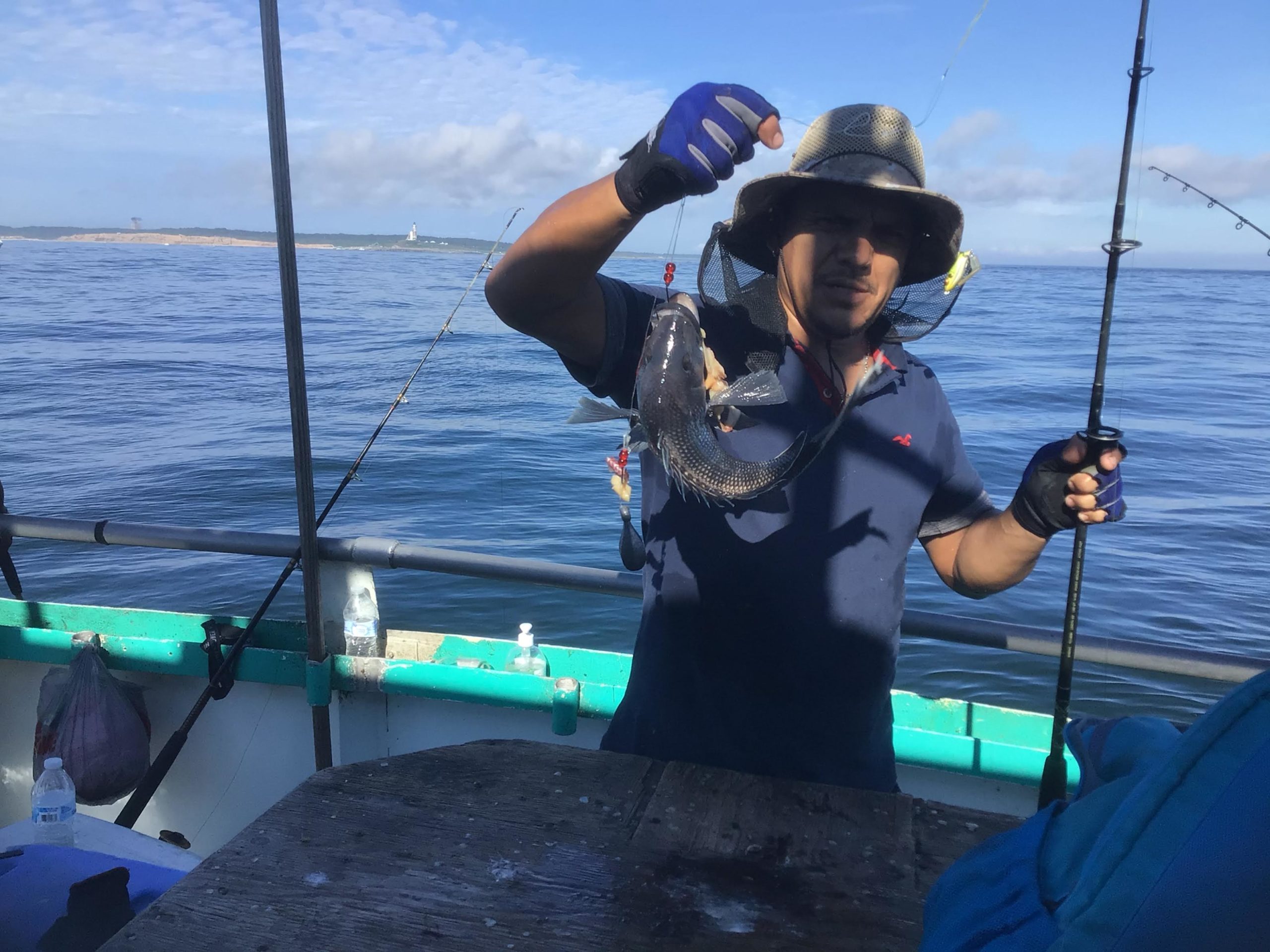 a person standing next to a body of water