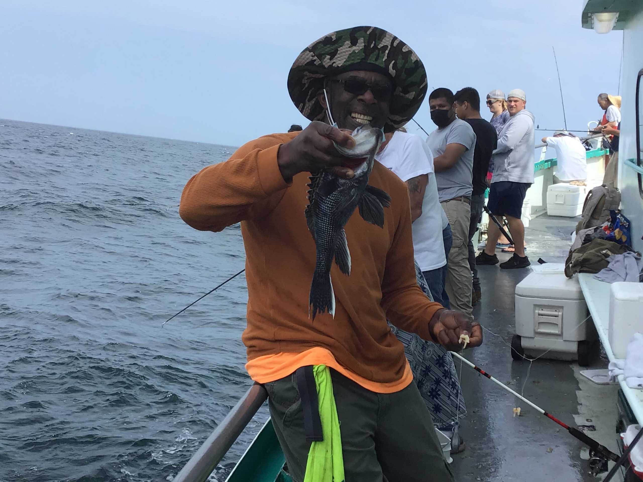 a couple of people that are standing in the water