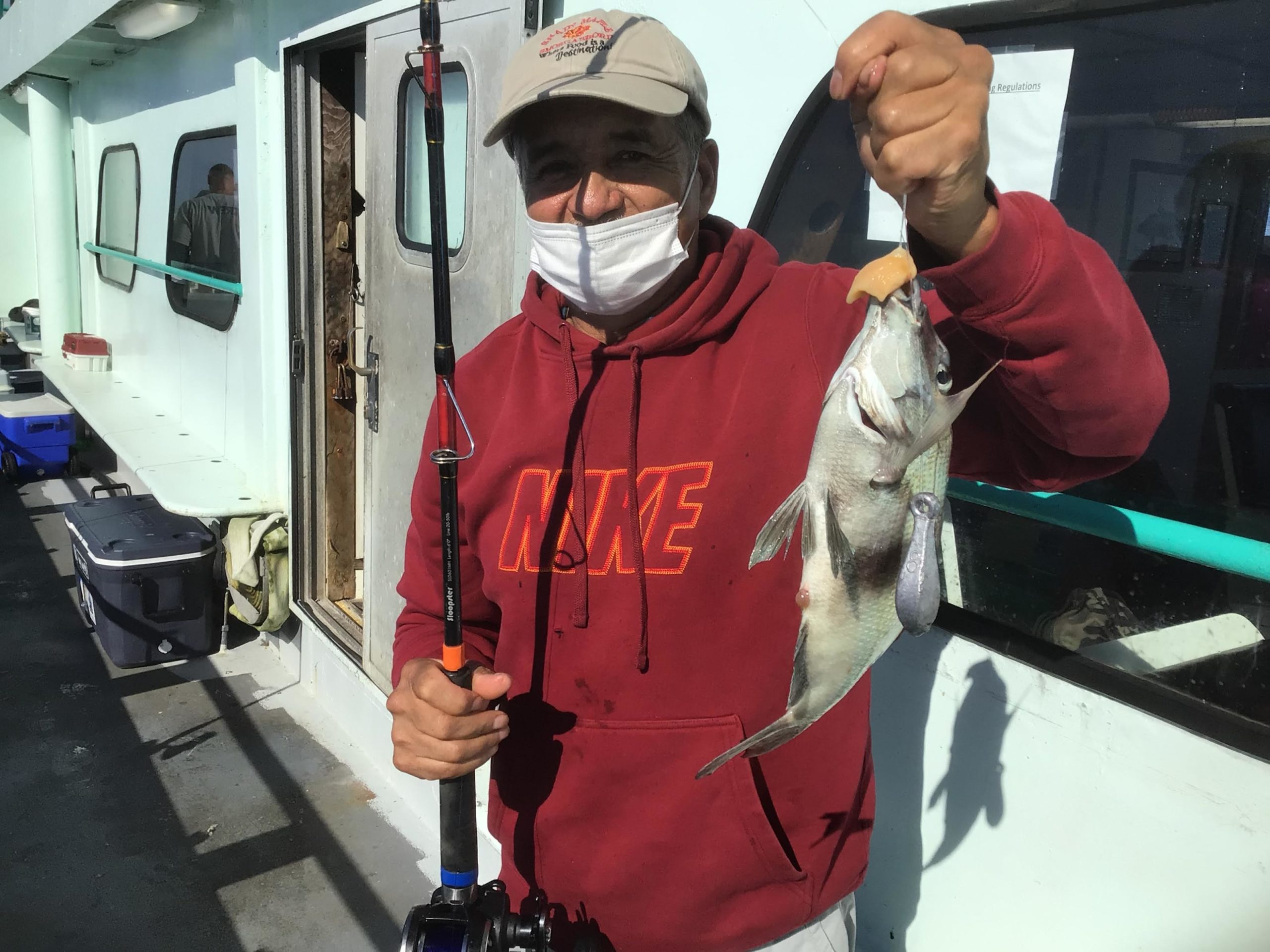 a man holding a fish