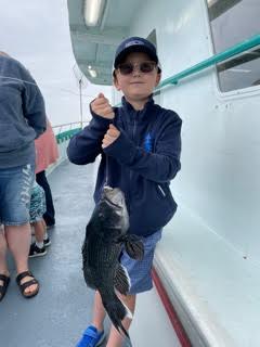 a person holding a fish