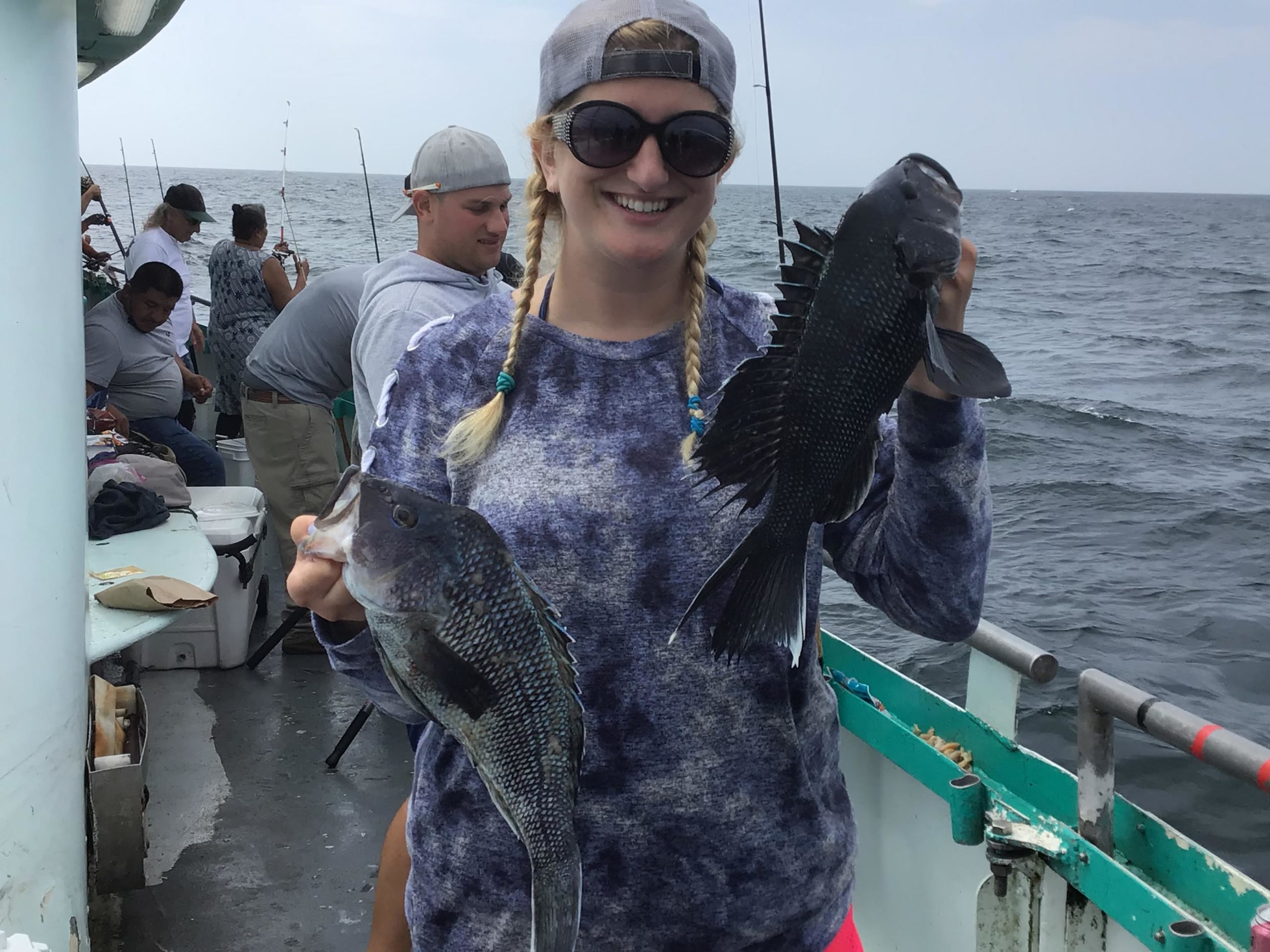 a person holding a fish in the water