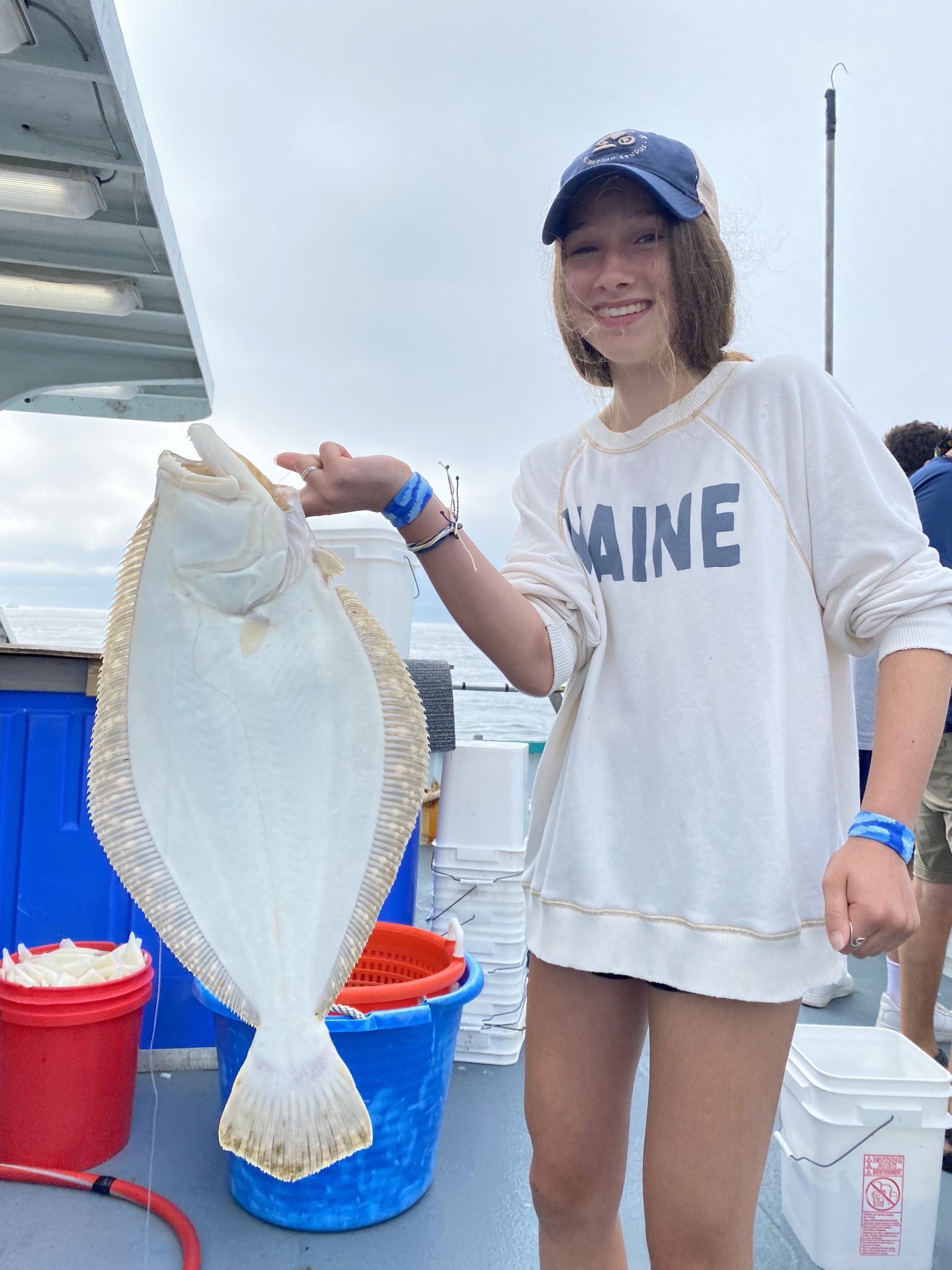 a man standing next to a woman