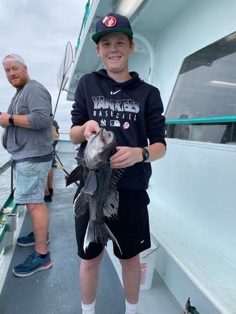 a person holding a fish