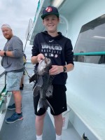 a person holding a fish