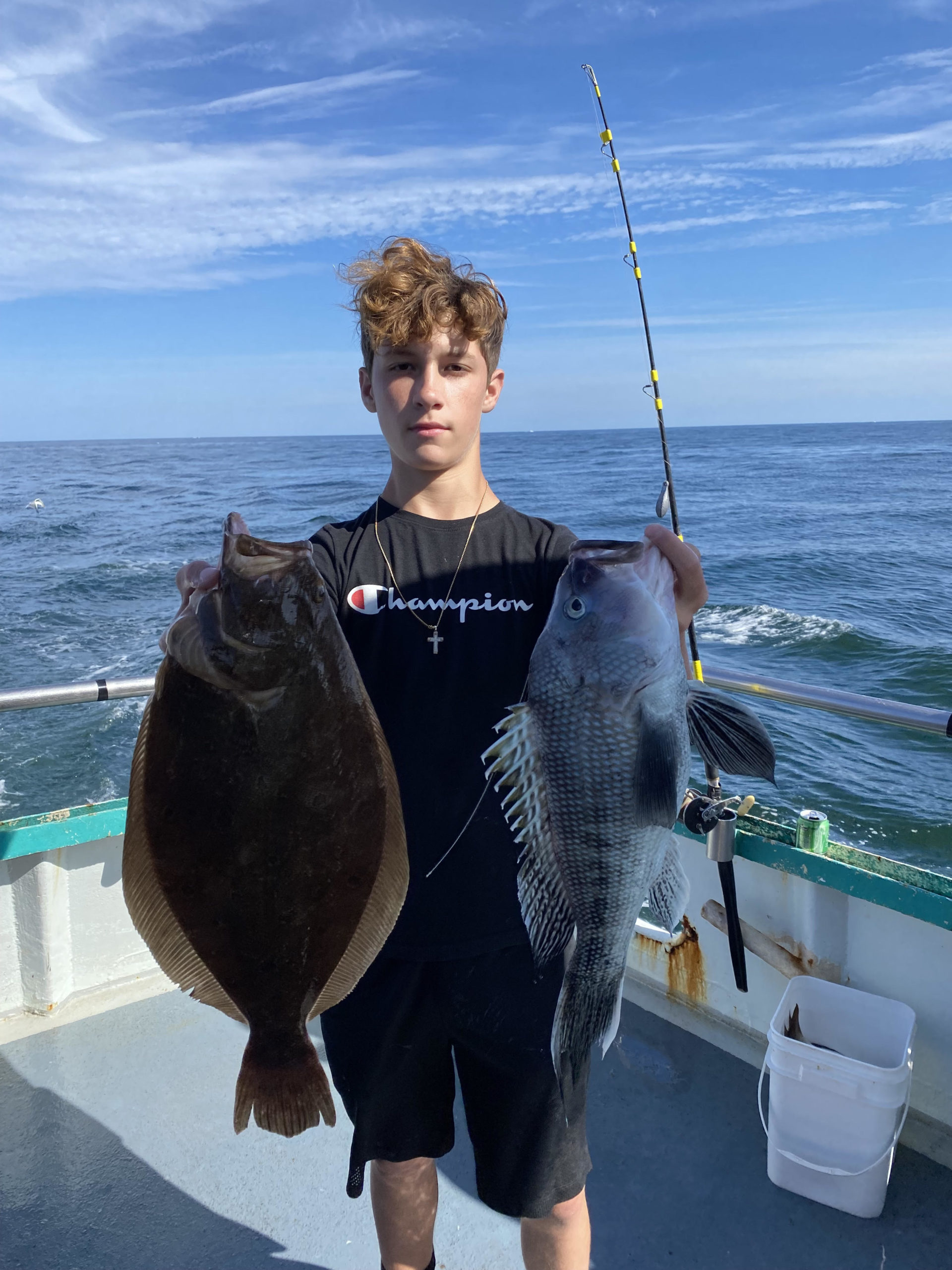 a man holding a fish in the water