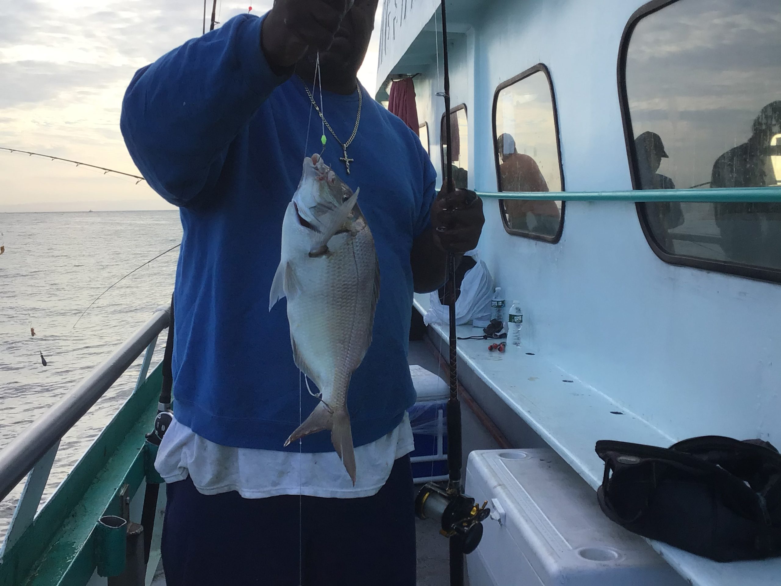 a person holding a fish