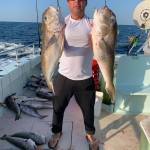 a man holding a fish