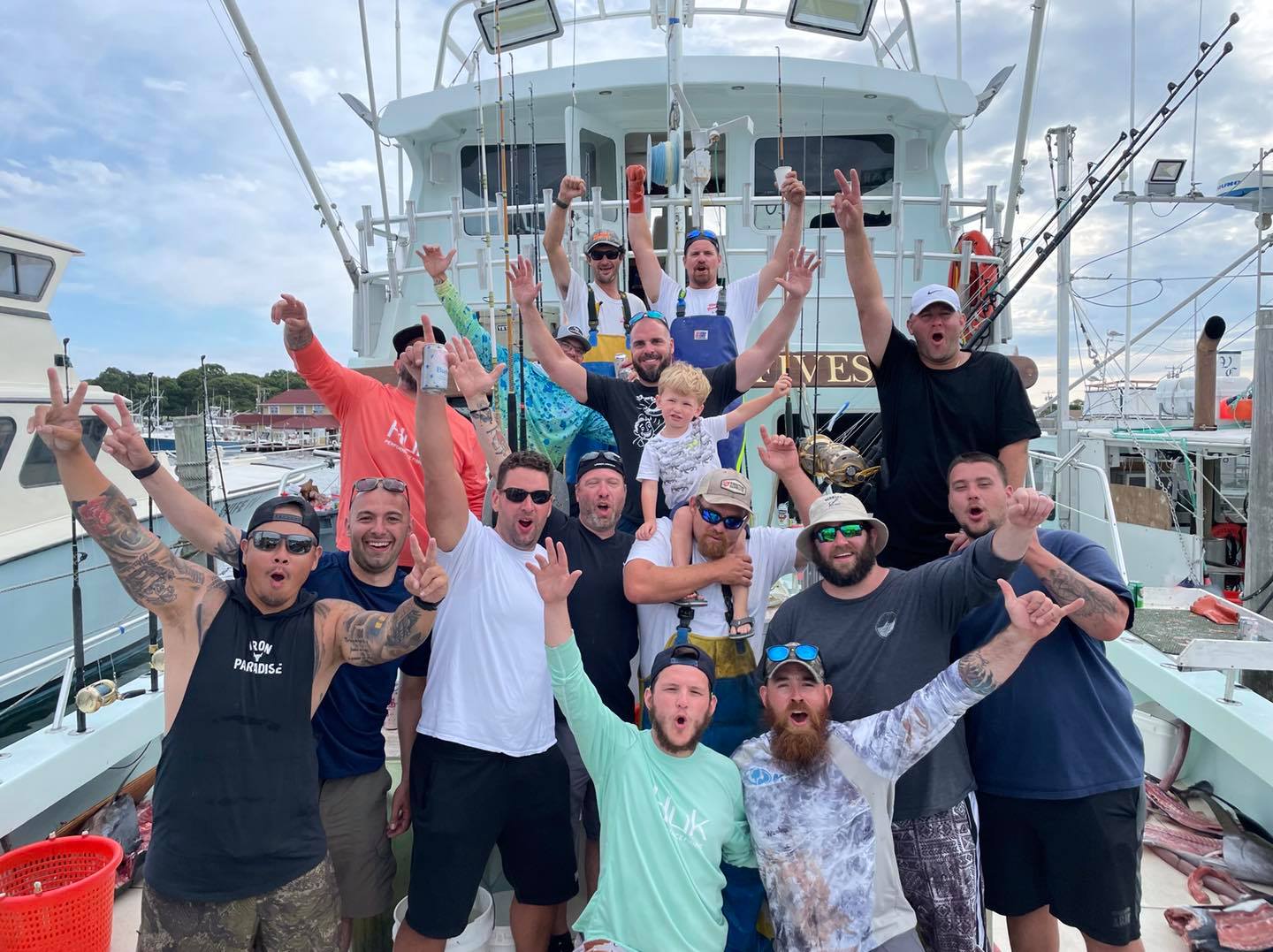 a group of people on a boat posing for the camera