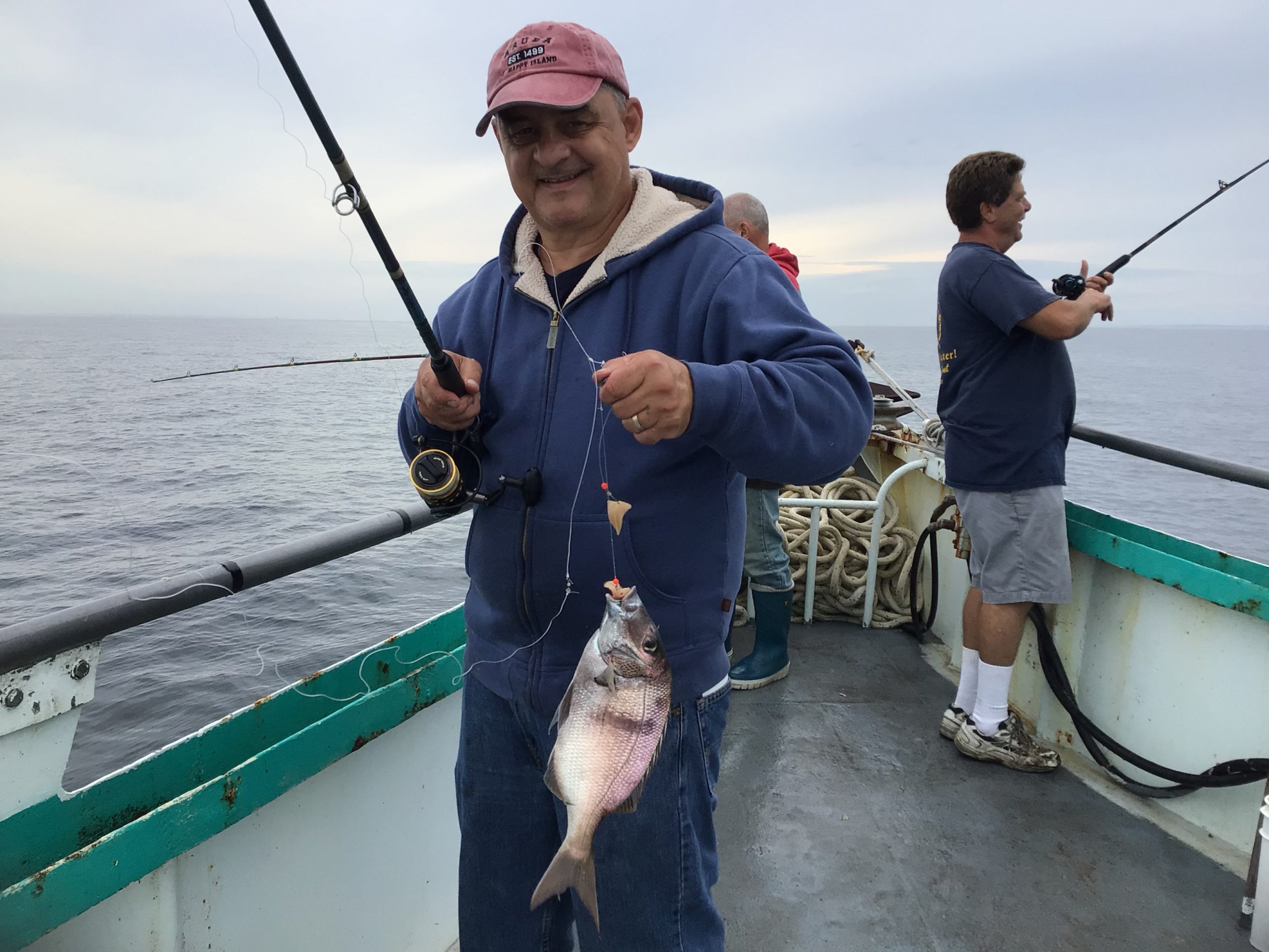a man standing on a boat in the water