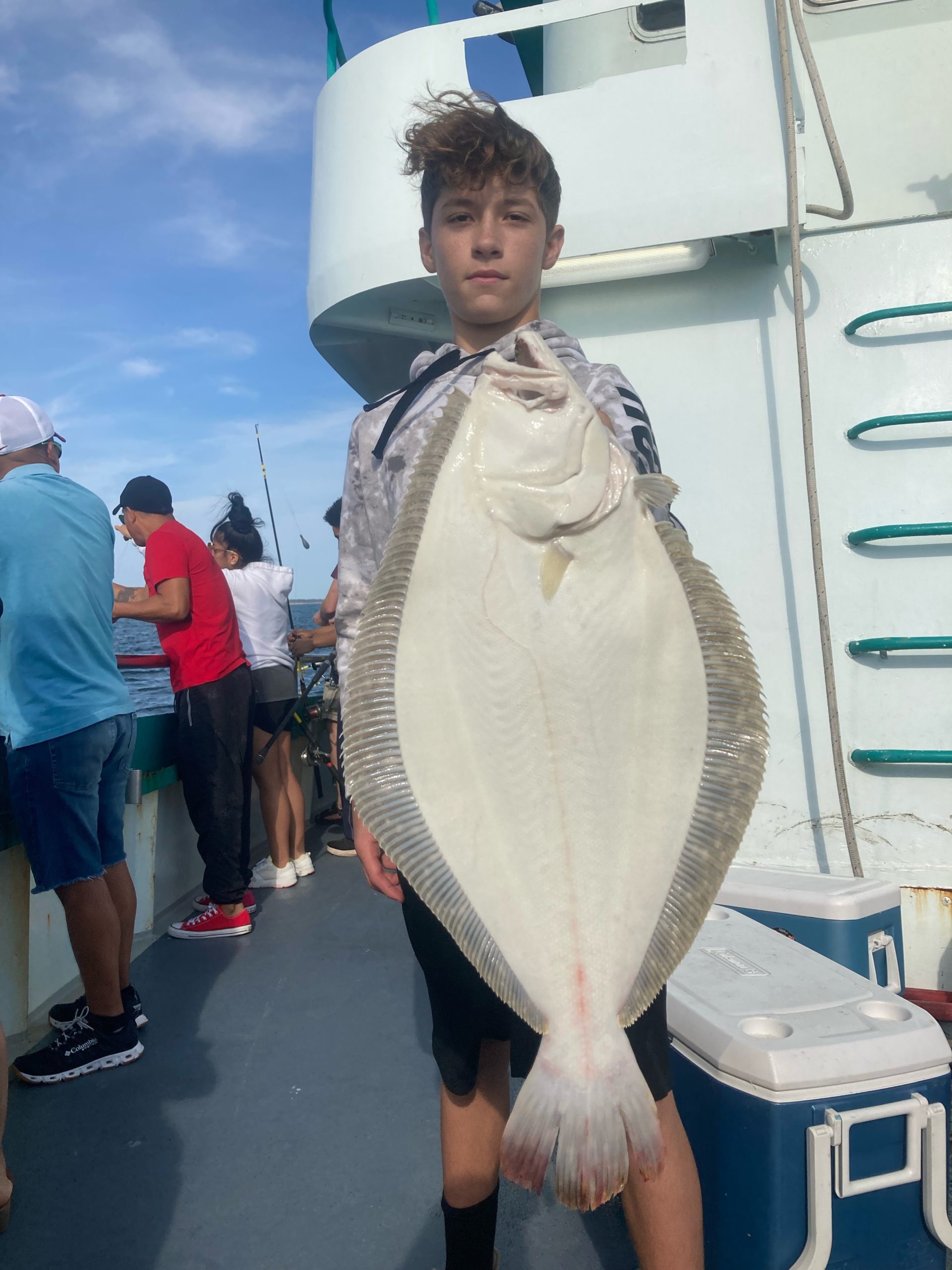 a person holding a fish