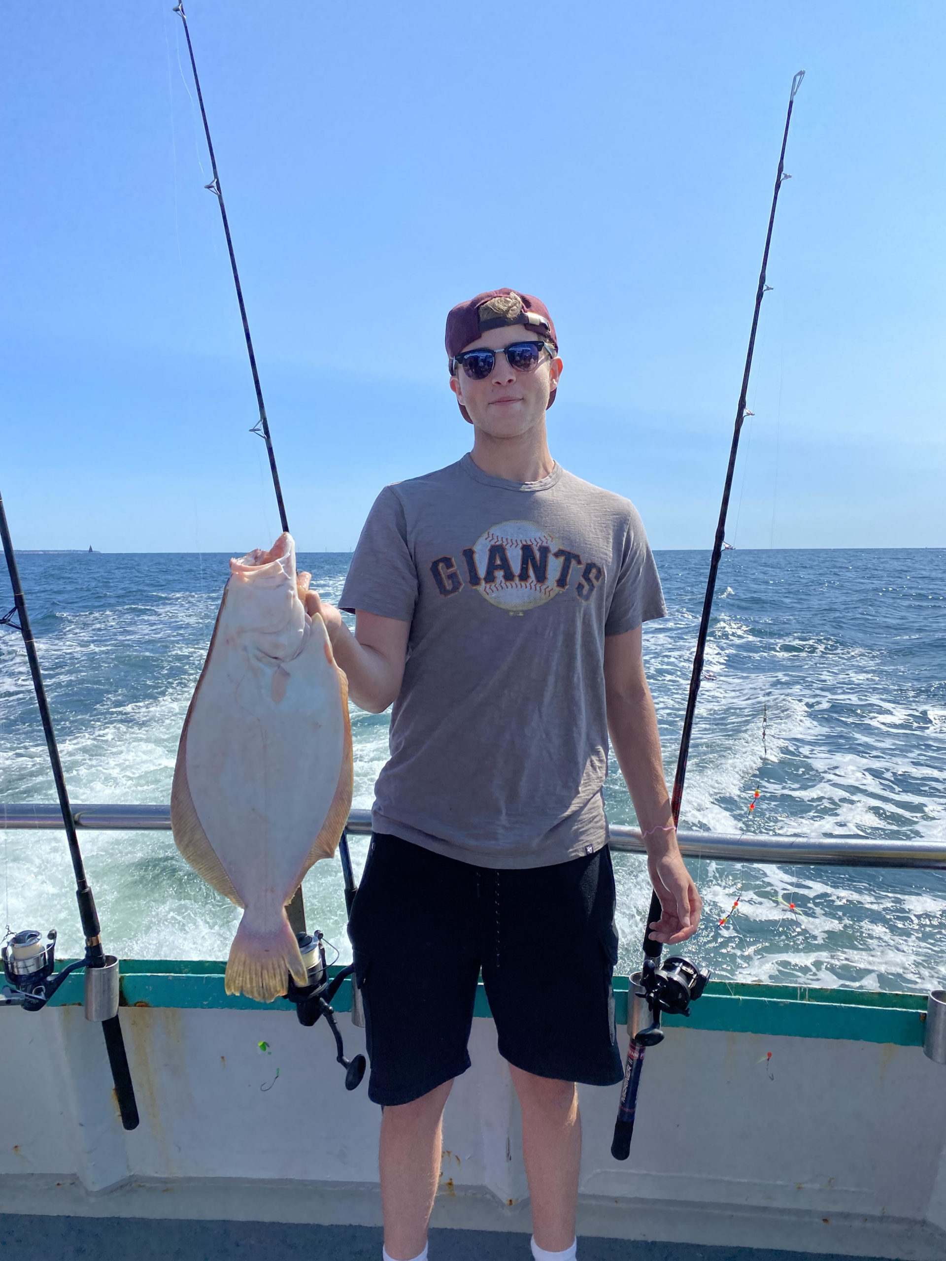 a man holding a fish in the water