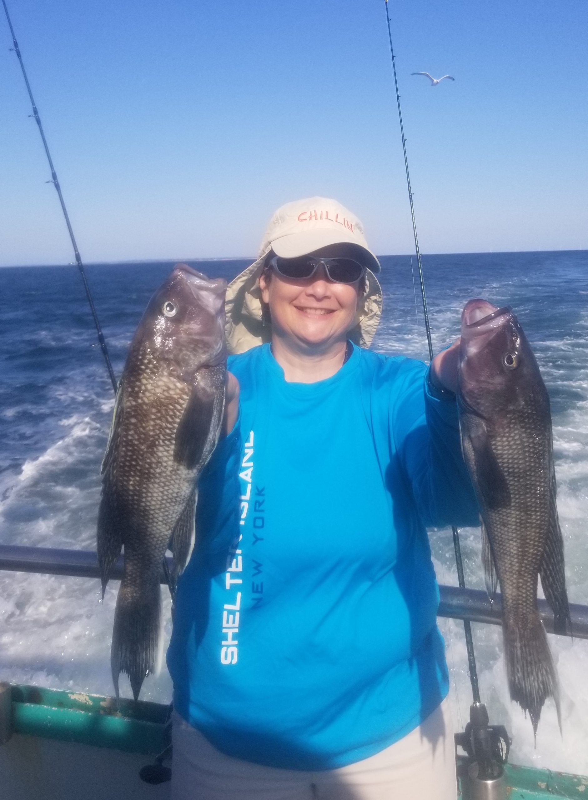 a person holding a fish in the water