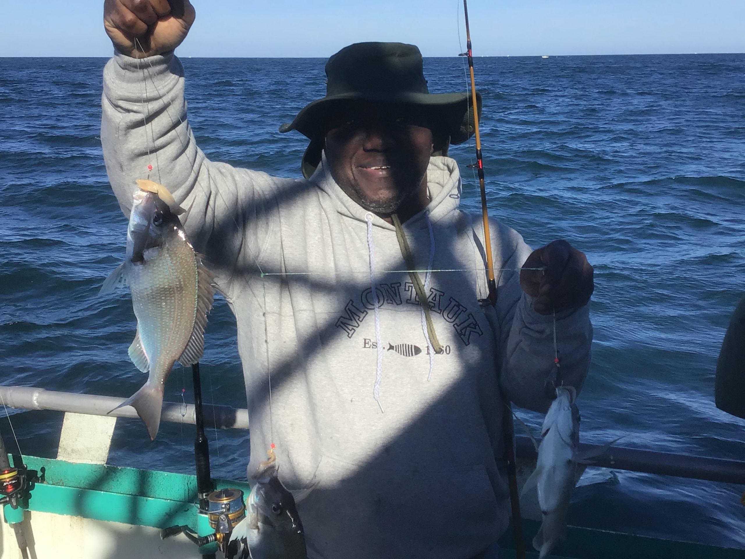 a person holding a fish in the water