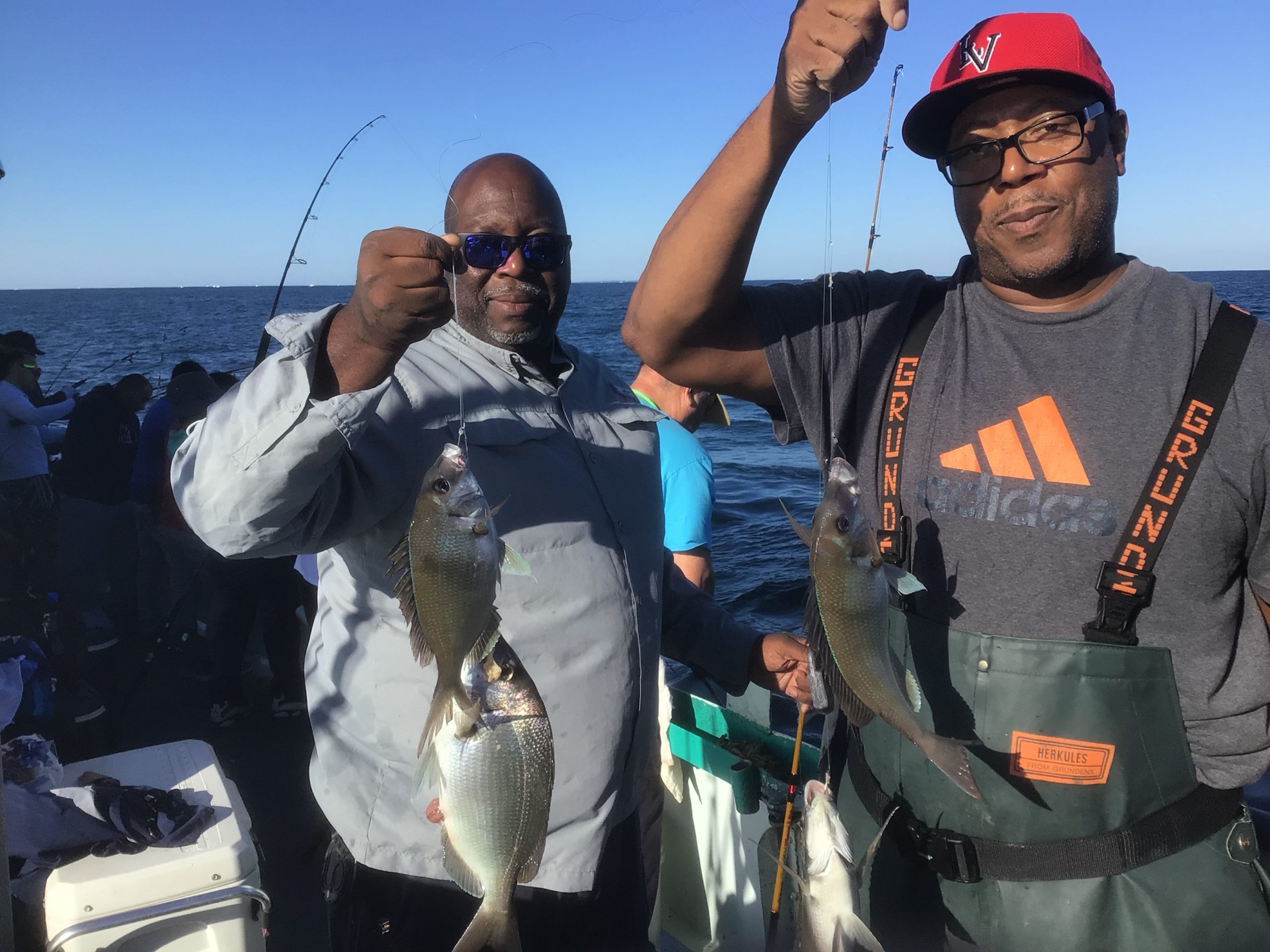 a man holding a fish