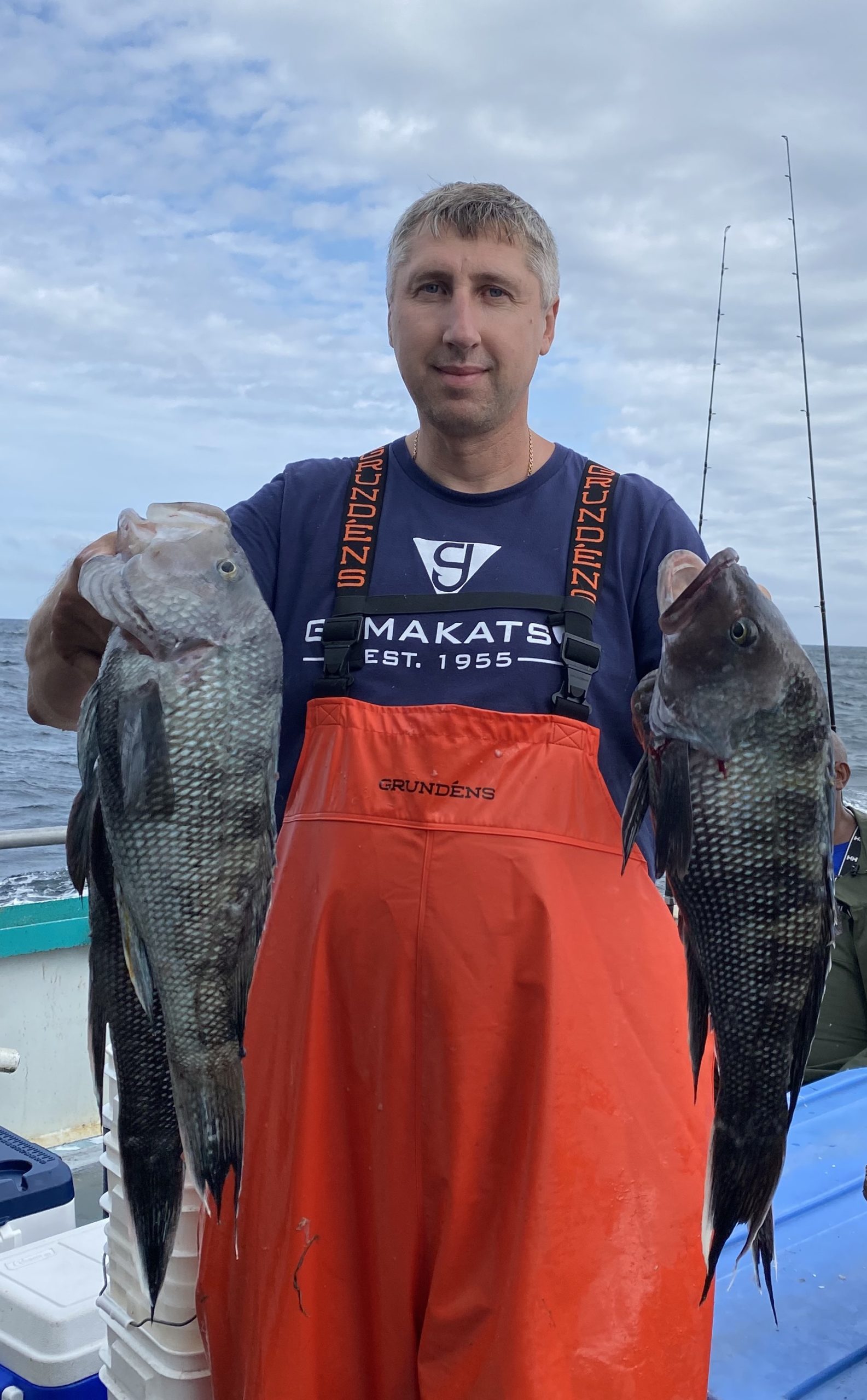 a man holding a fish
