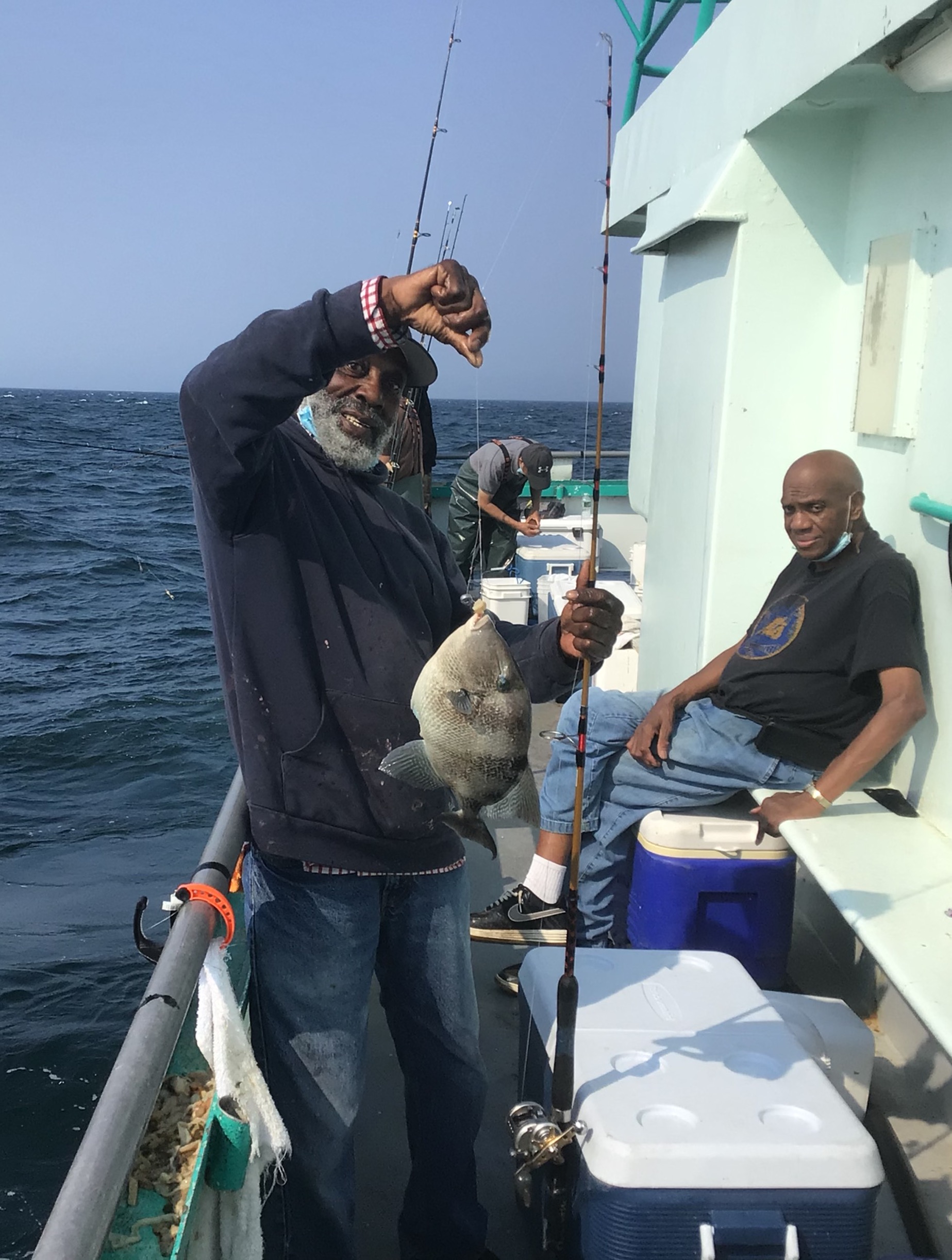 a person standing next to a boat