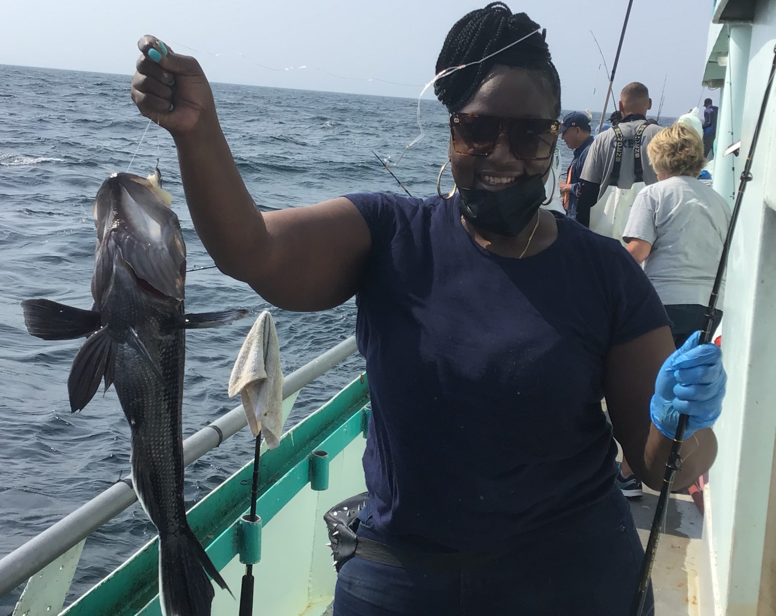 a man holding a fish in the water