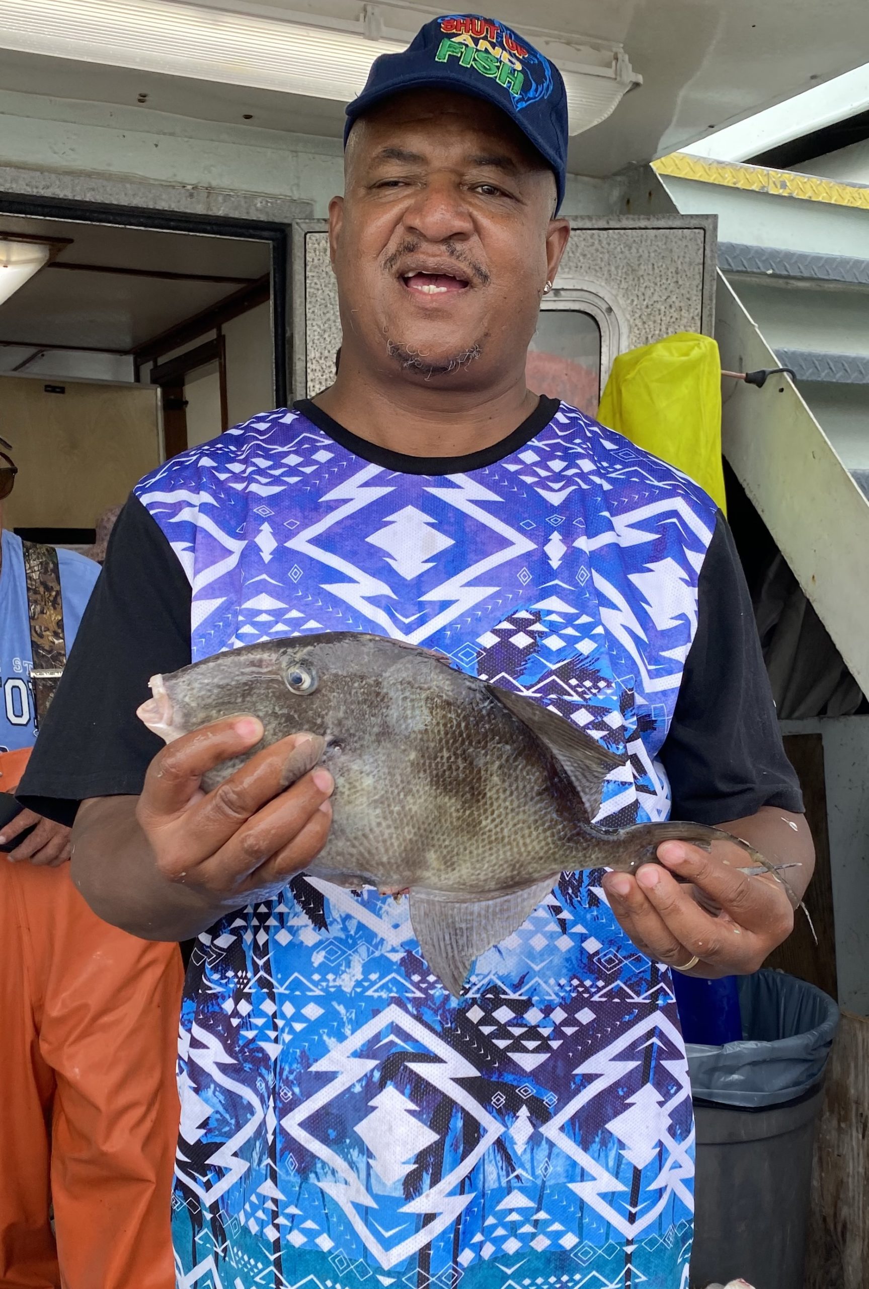 a man wearing a blue hat