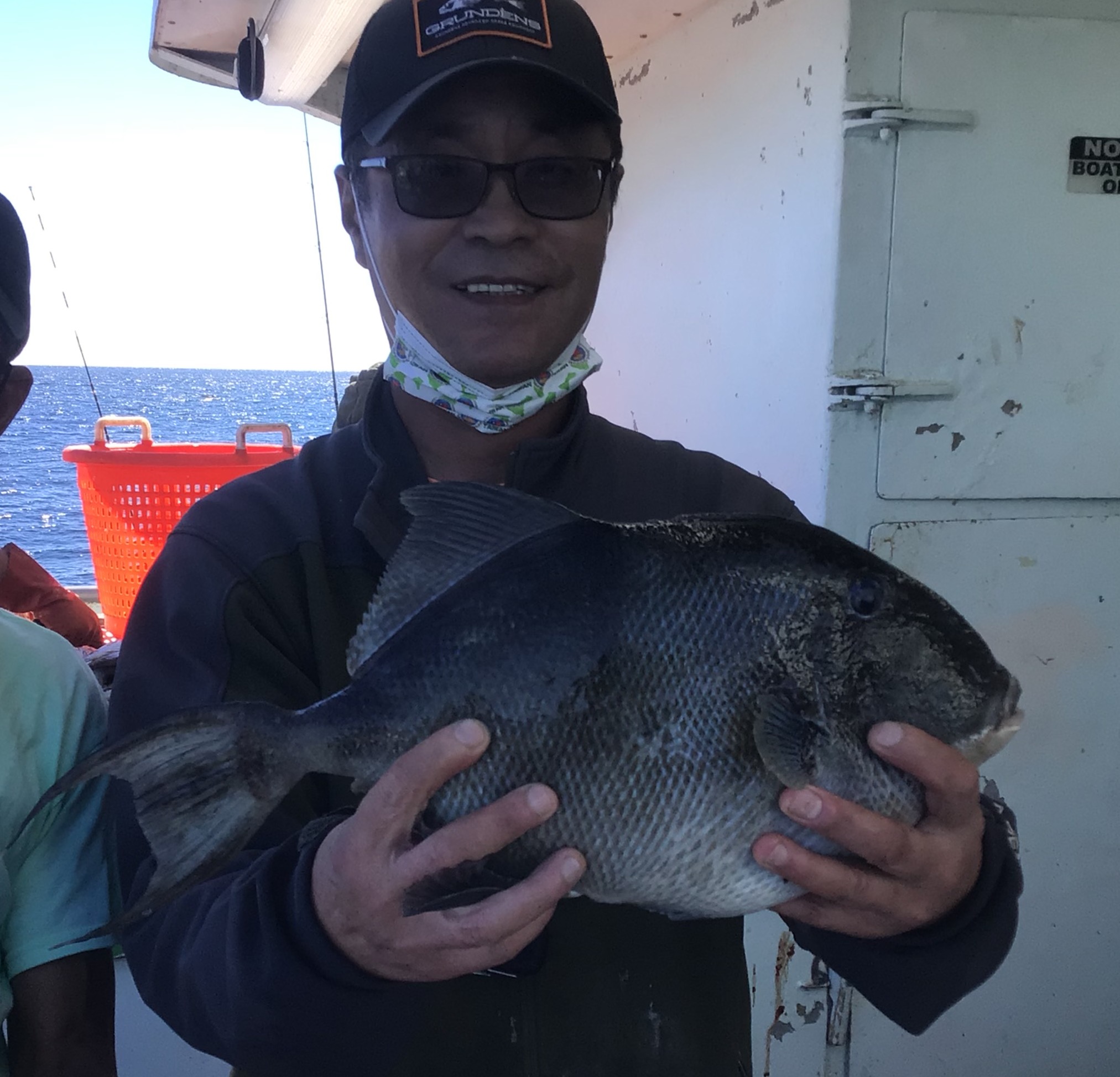 a person holding a fish