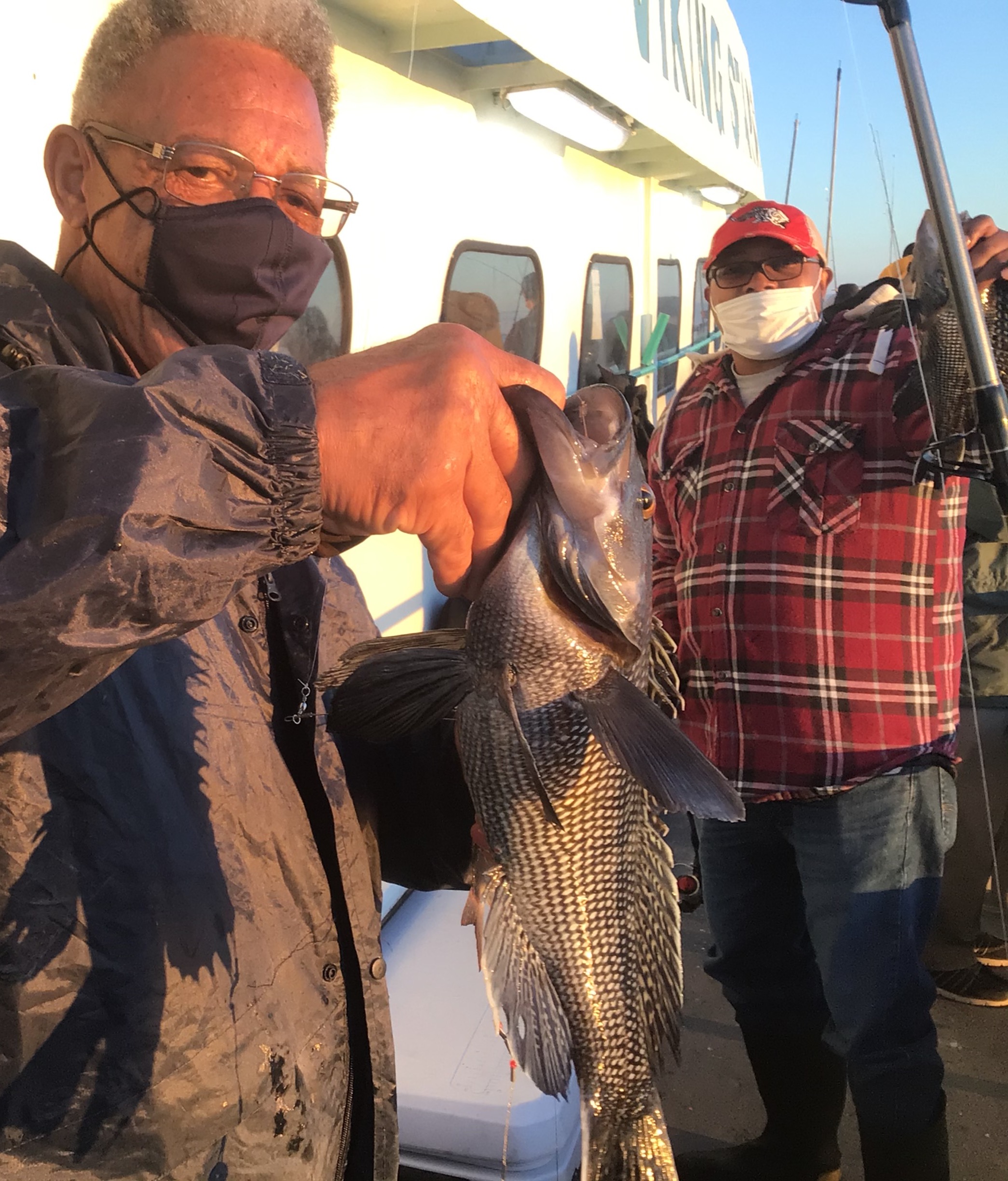 a group of people standing next to a man