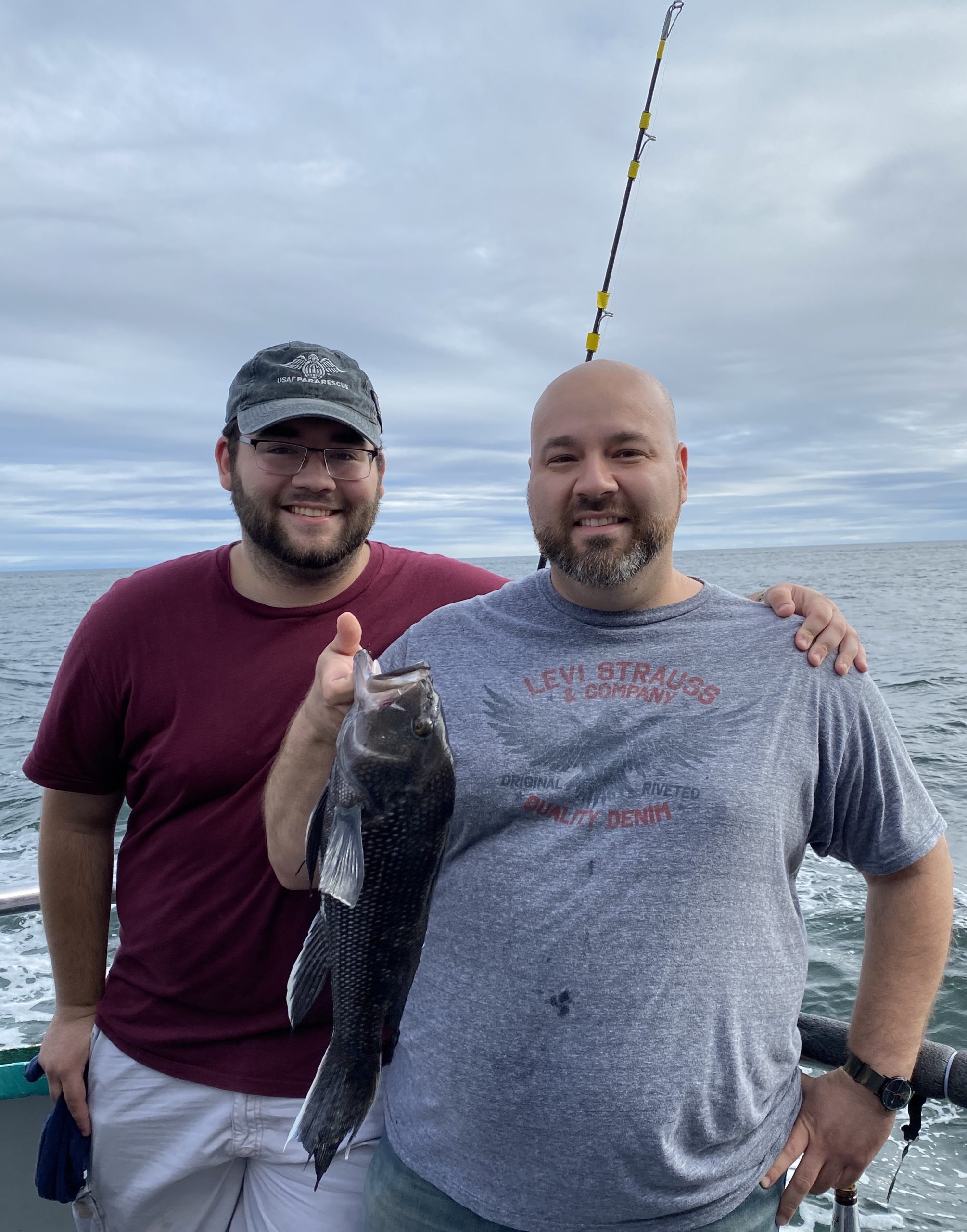 a man holding a fish in the water