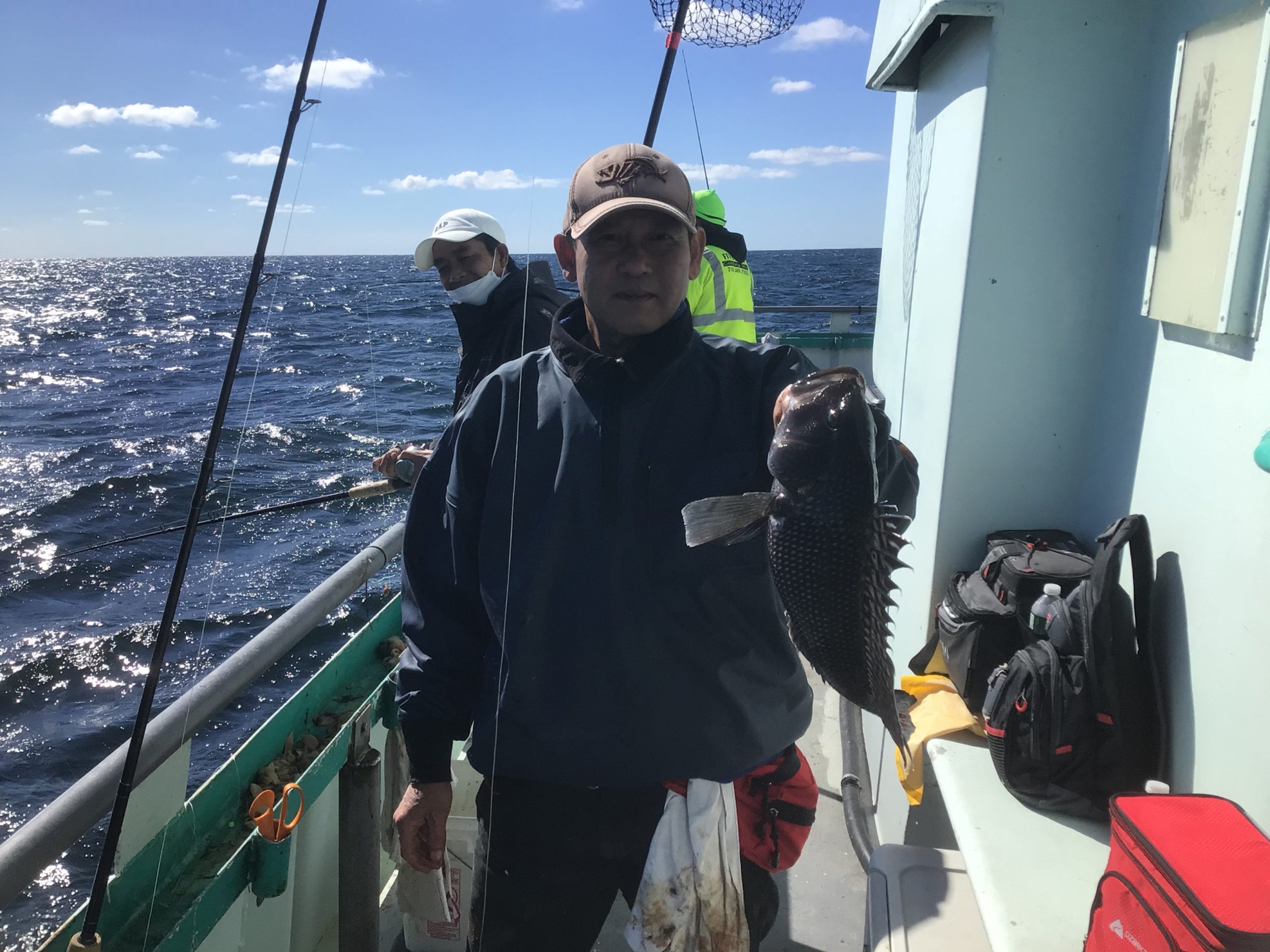 a person holding a fish in the water