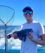 a person wearing sunglasses taking a selfie