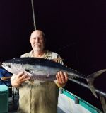 a person holding a fish