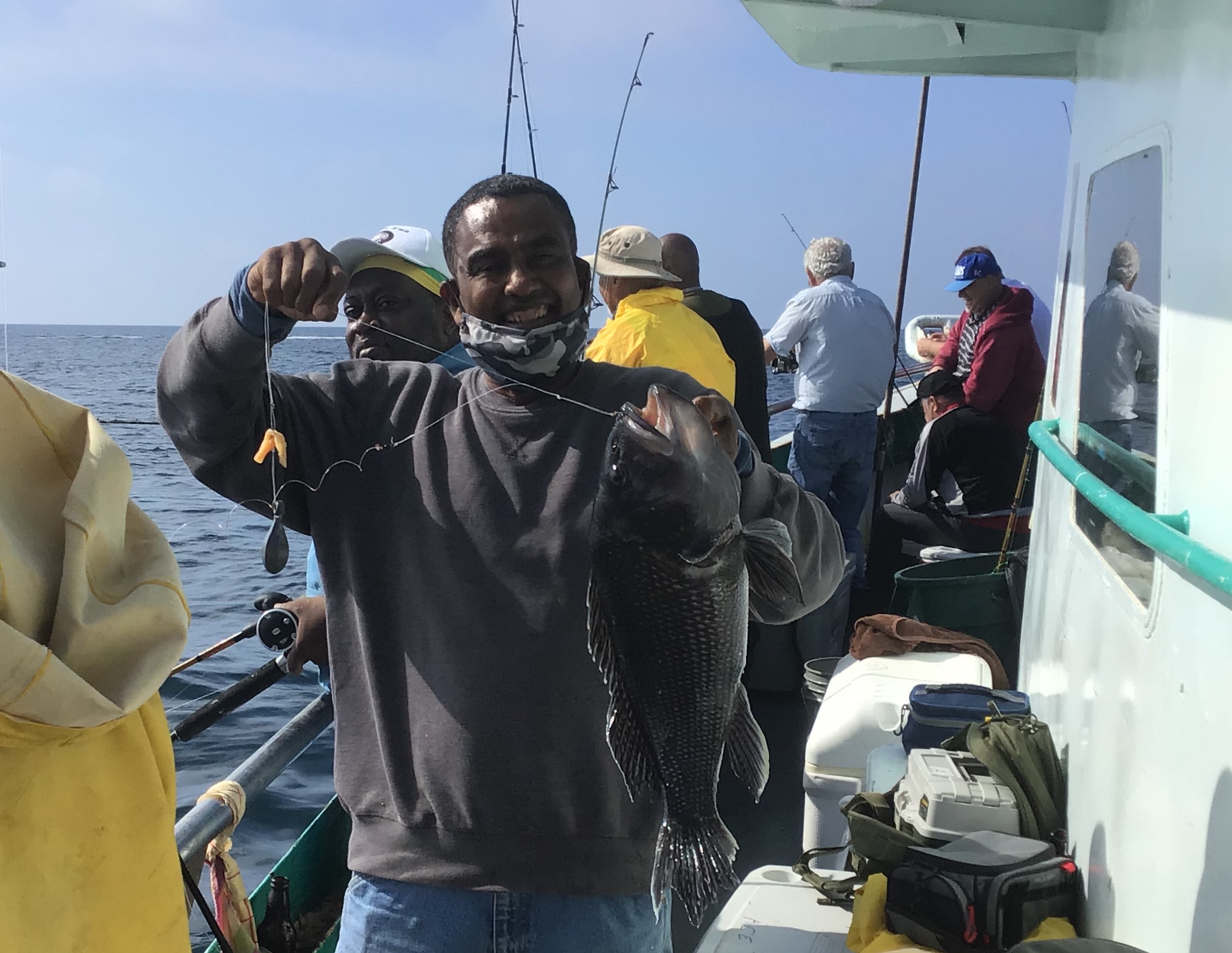 a group of people standing on a boat