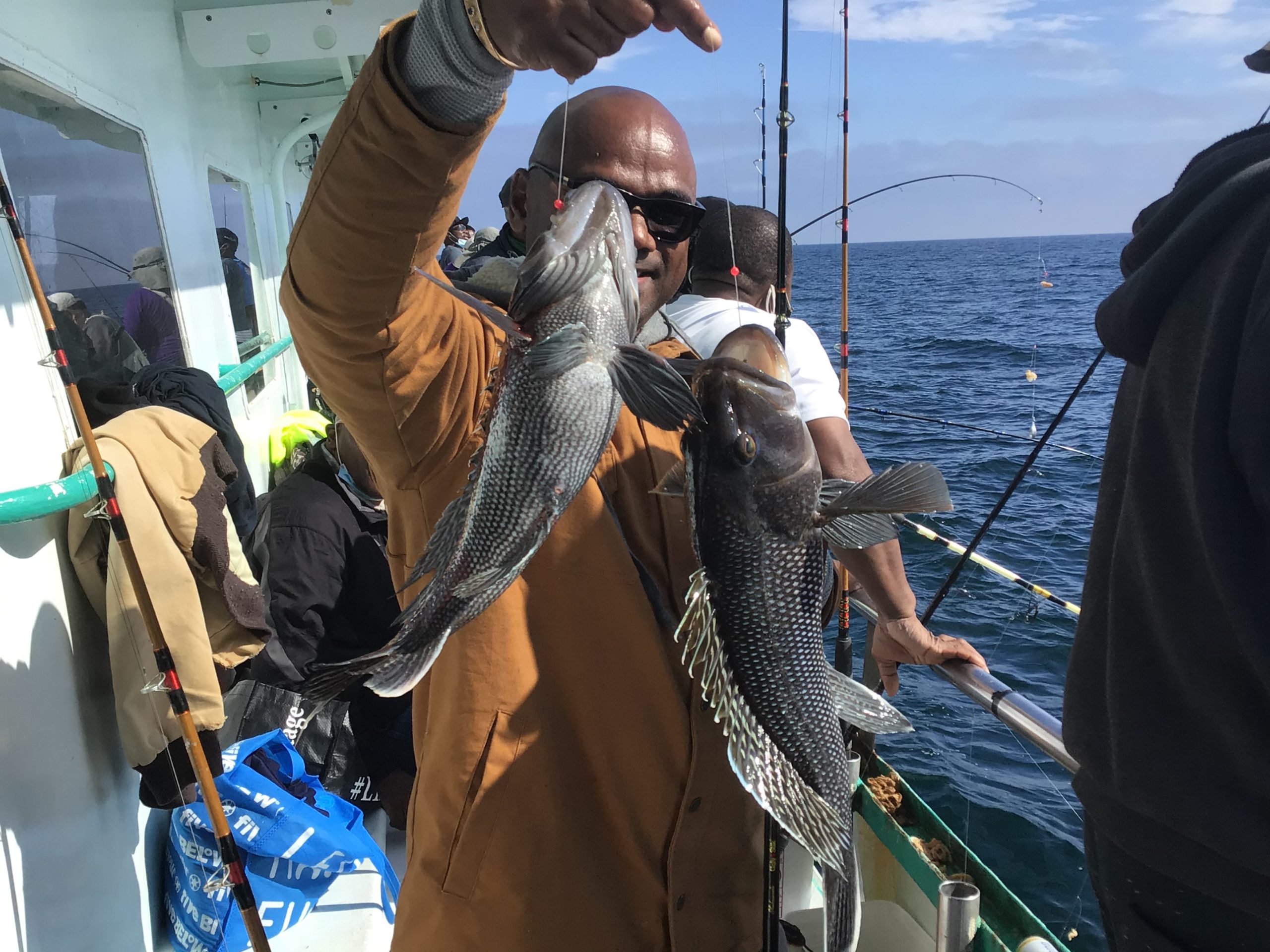 a man holding a fish