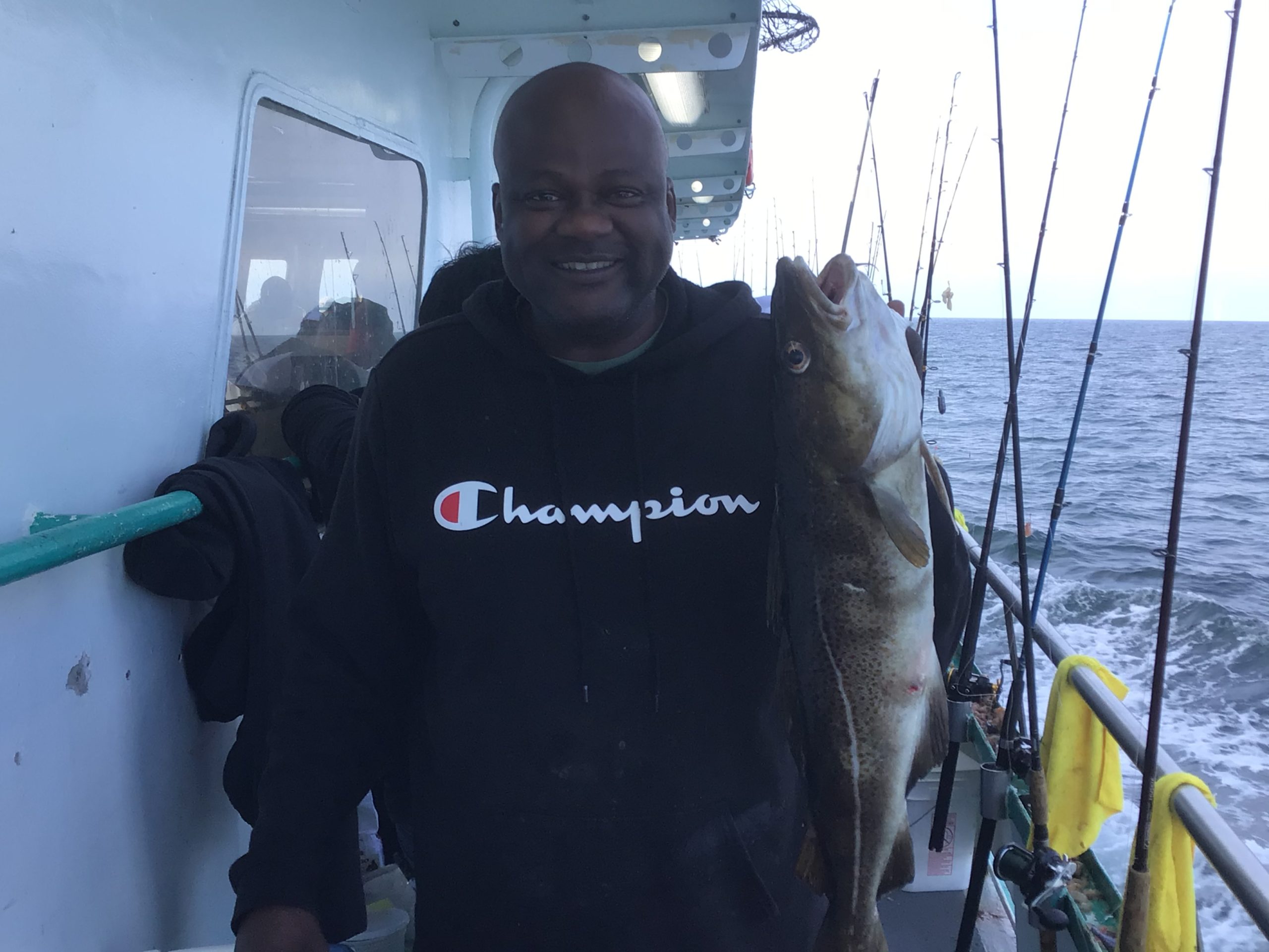 a man holding a fish