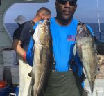 a man holding a fish