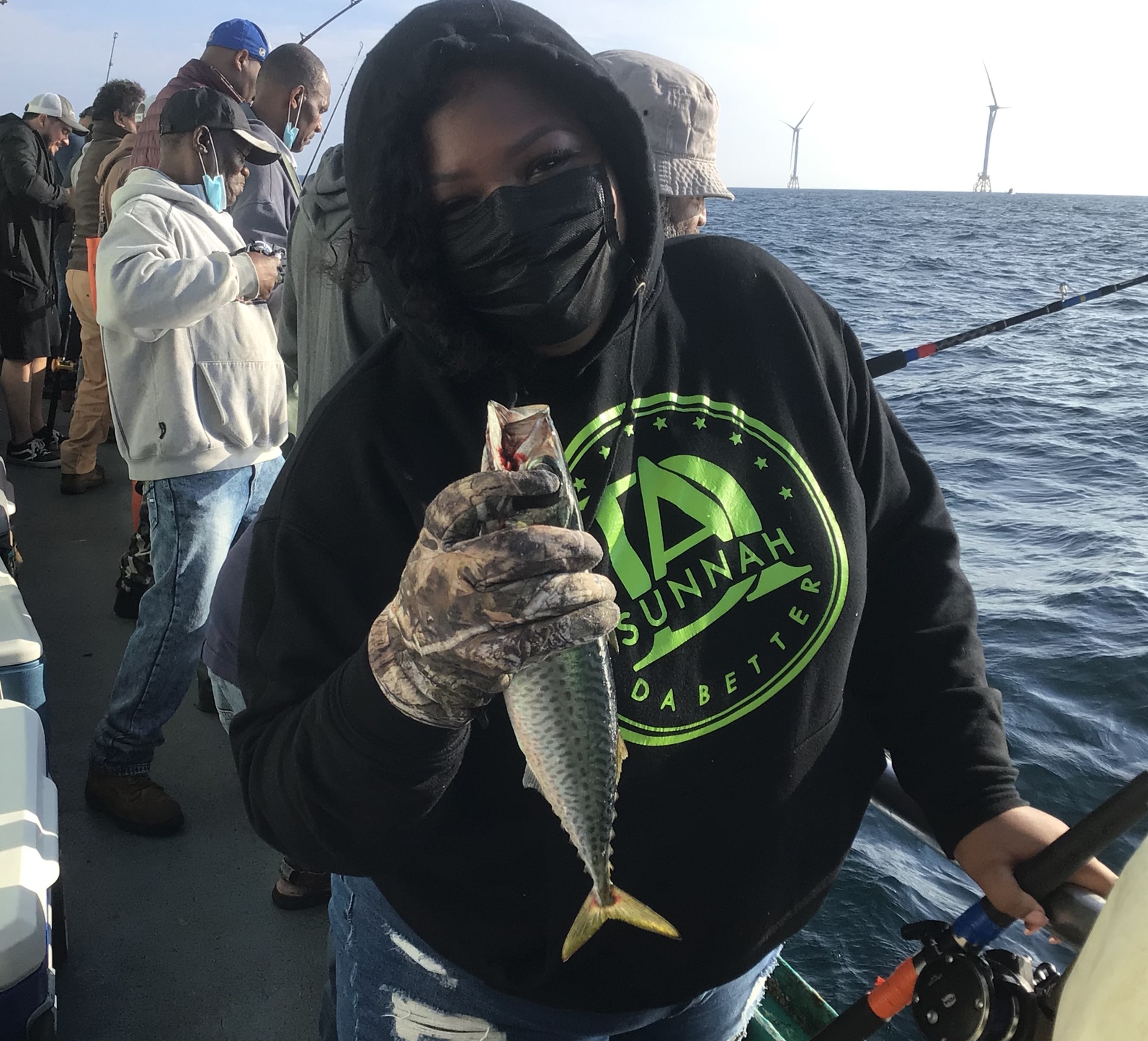 a group of people on a boat in the water