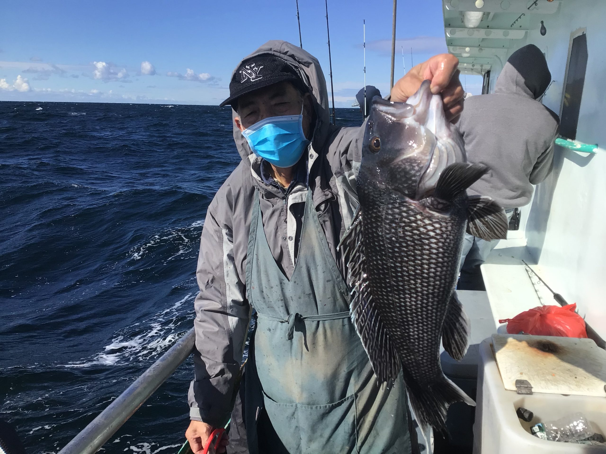 a person holding a fish in the water