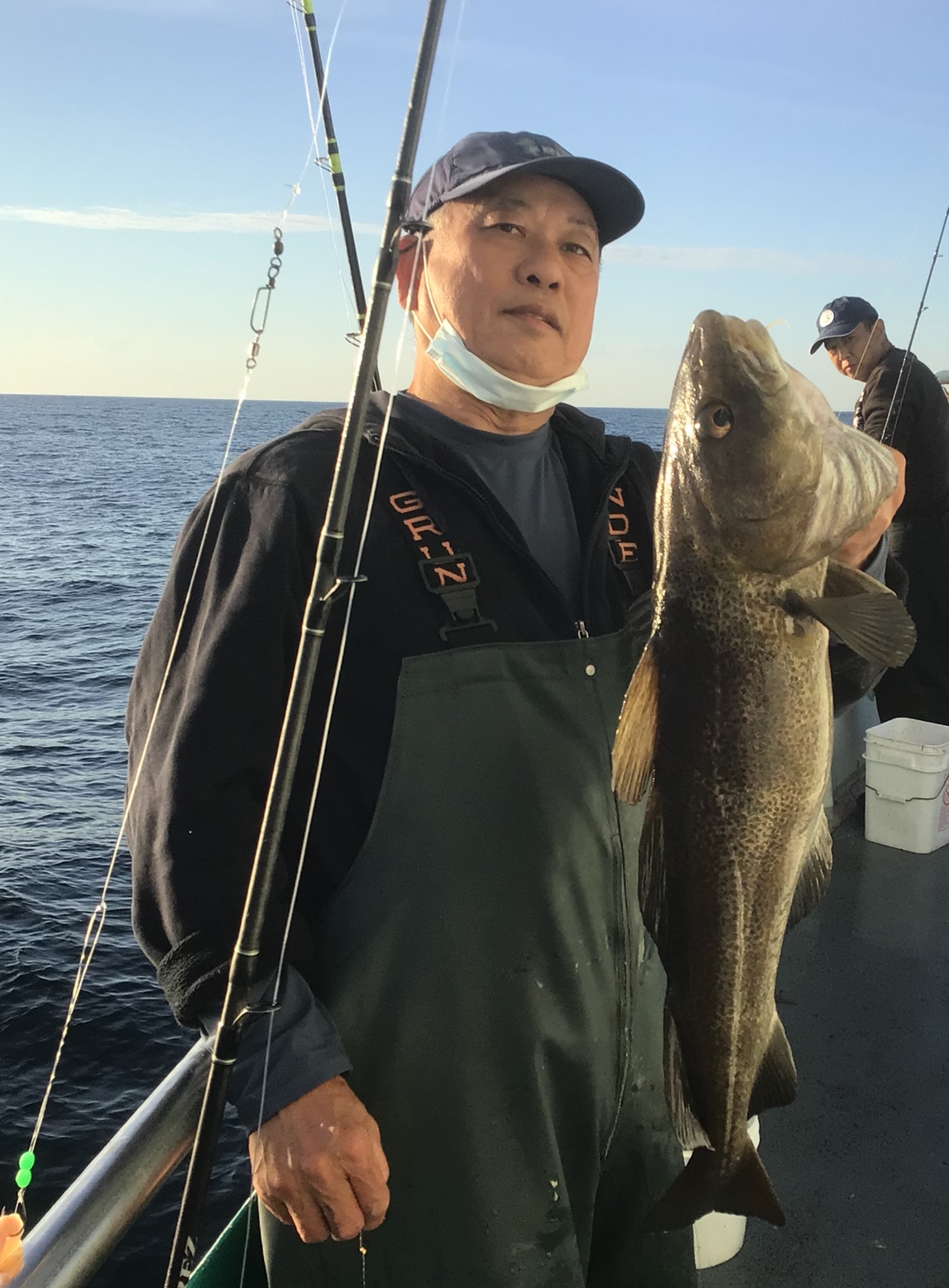 a person holding a fish in the water