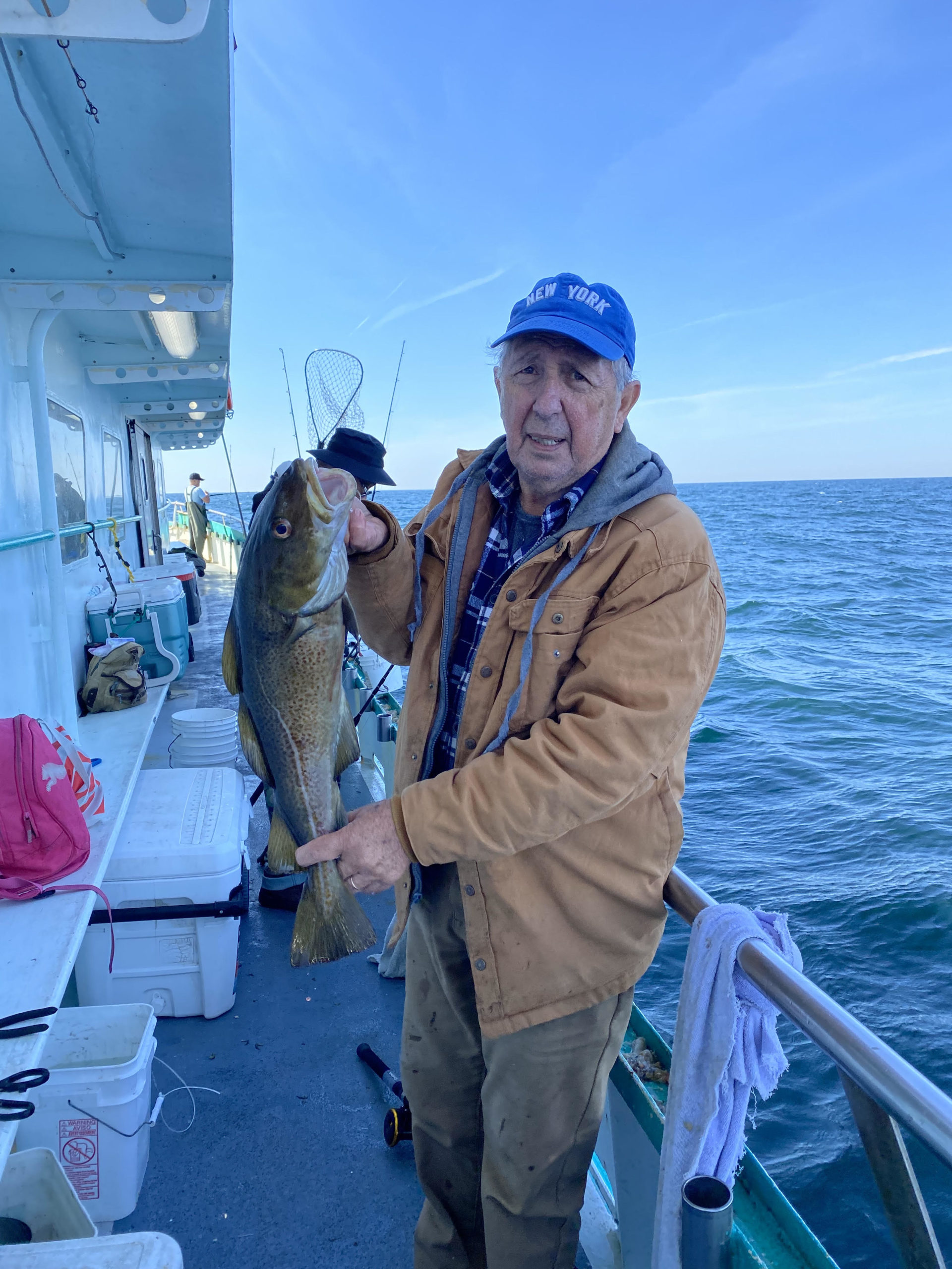 a person holding a fish