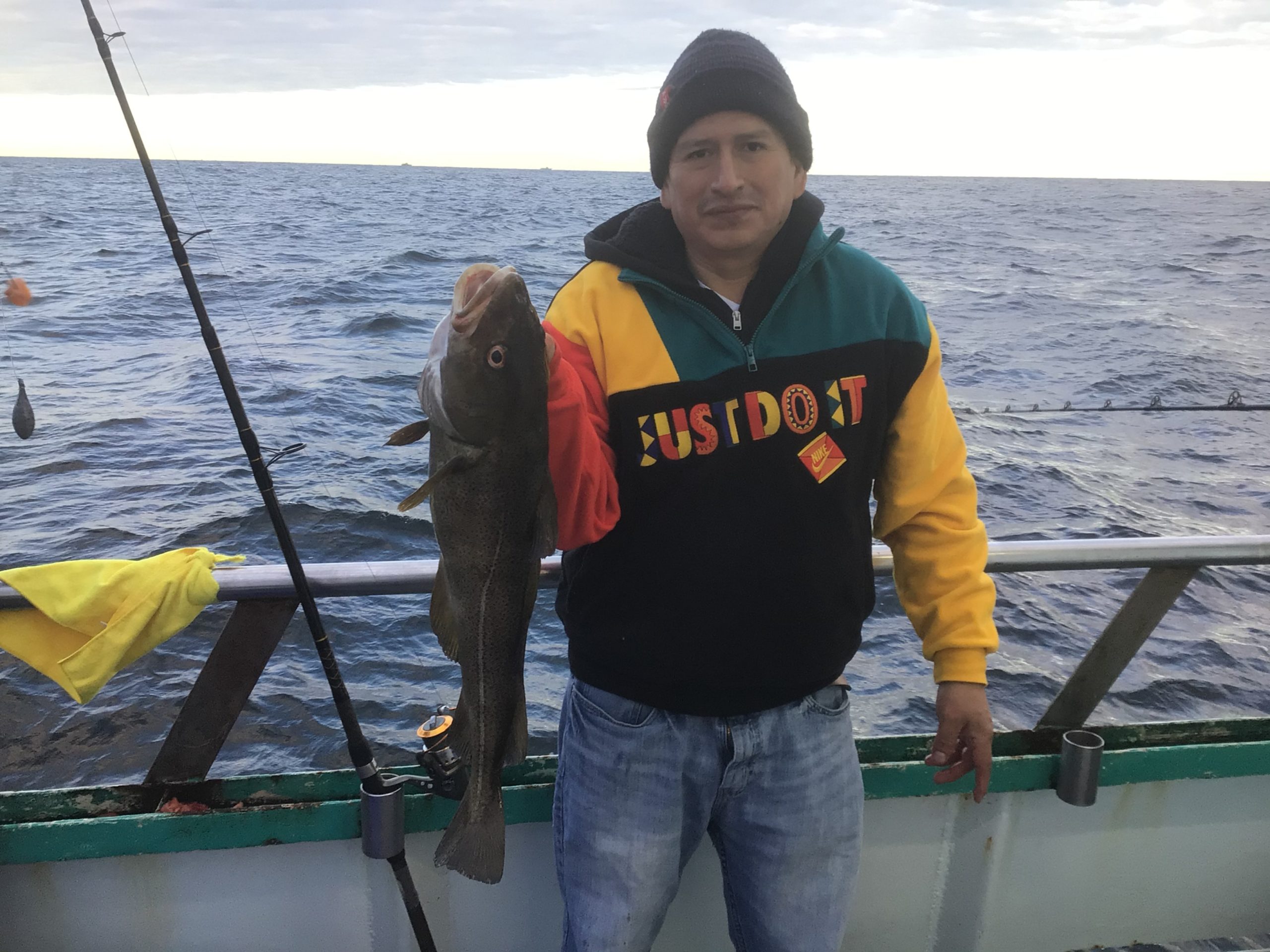 a person standing next to a body of water